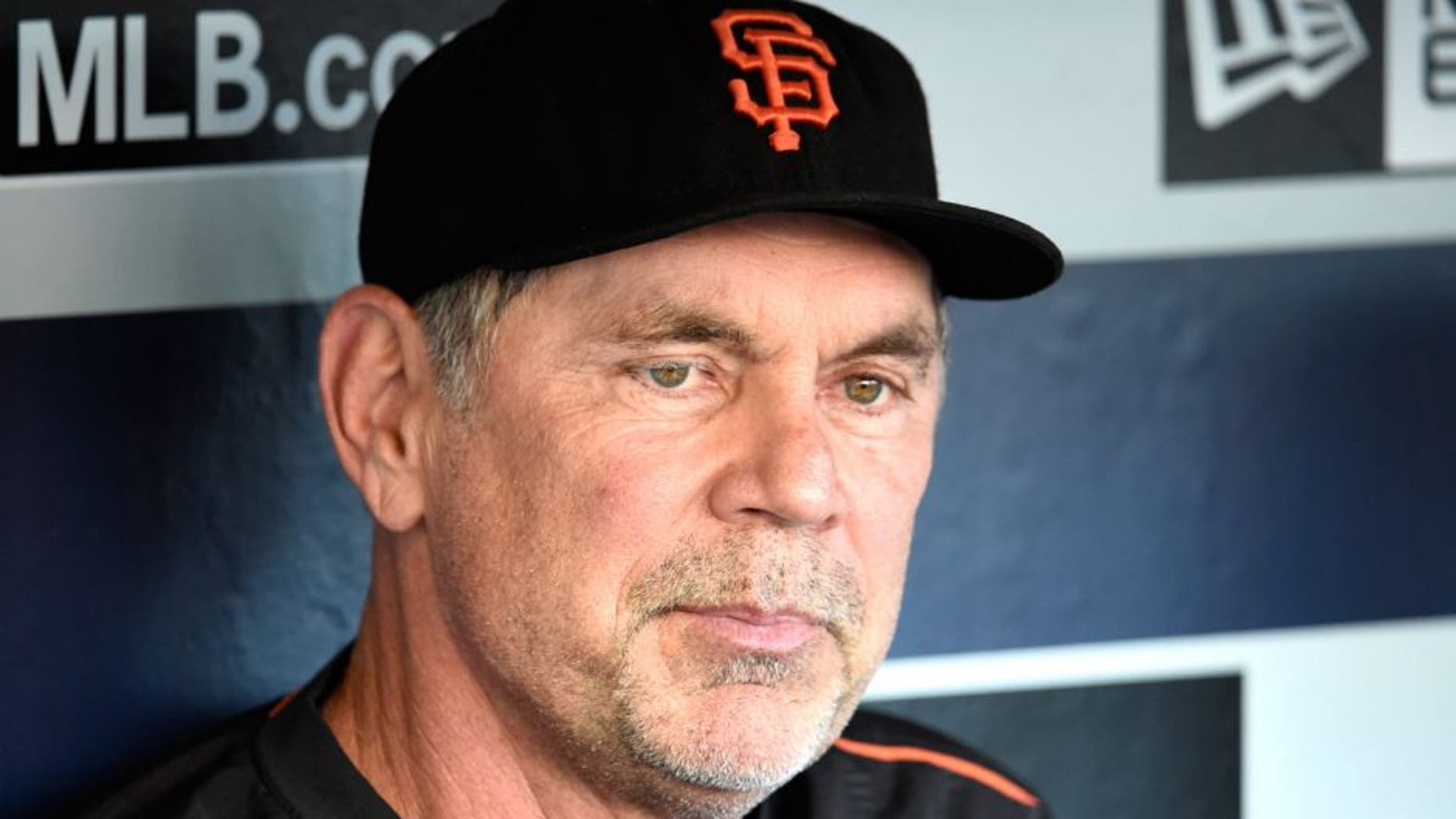SAN DIEGO, CA - SEPTEMBER 22: Bruce Bochy #15 of the San Francisco Giants answers a question in the dugout before a baseball game against the San Diego Padres at Petco Park September 22, 2015 in San Diego, California. (Photo by Denis Poroy/Getty Images)