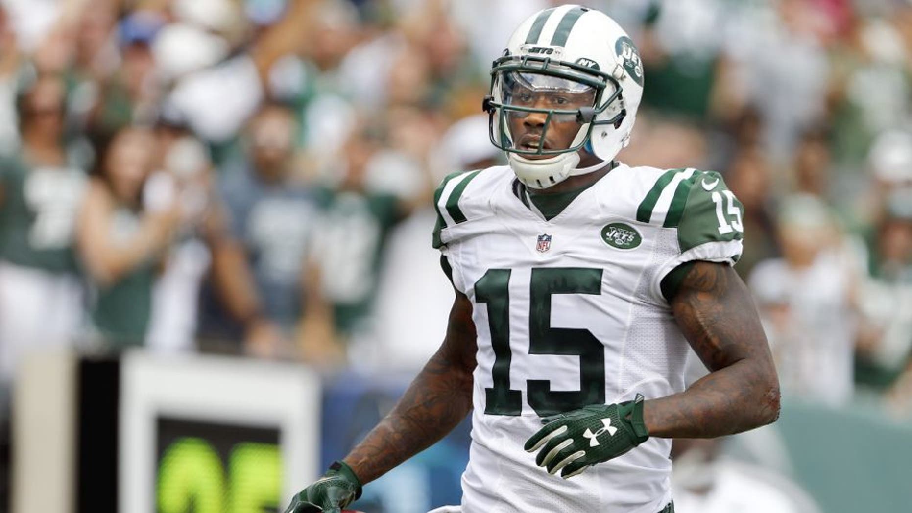 EAST RUTHERFORD, NJ - SEPTEMBER 13: Brandon Marshall #15 of the New York Jets celebrates his touchdown against the Cleveland Browns during the third quarter of a game at MetLife Stadium on September 13, 2015 in East Rutherford, New Jersey. The Jets won 31-10. (Photo by Rich Schultz /Getty Images)