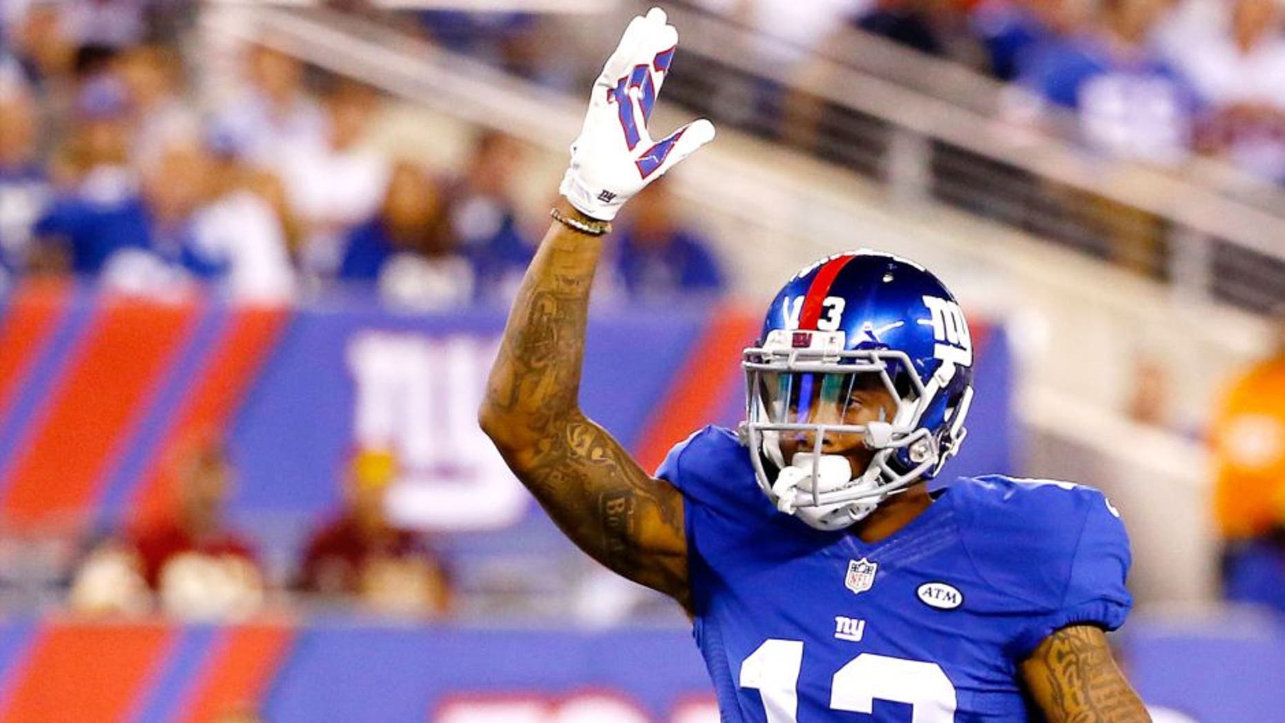 EAST RUTHERFORD, NJ - SEPTEMBER 24: Odell Beckham #13 of the New York Giants reacts in the first half against the Washington Redskins at MetLife Stadium on September 24, 2015 in East Rutherford, New Jersey. (Photo by Al Bello/Getty Images)