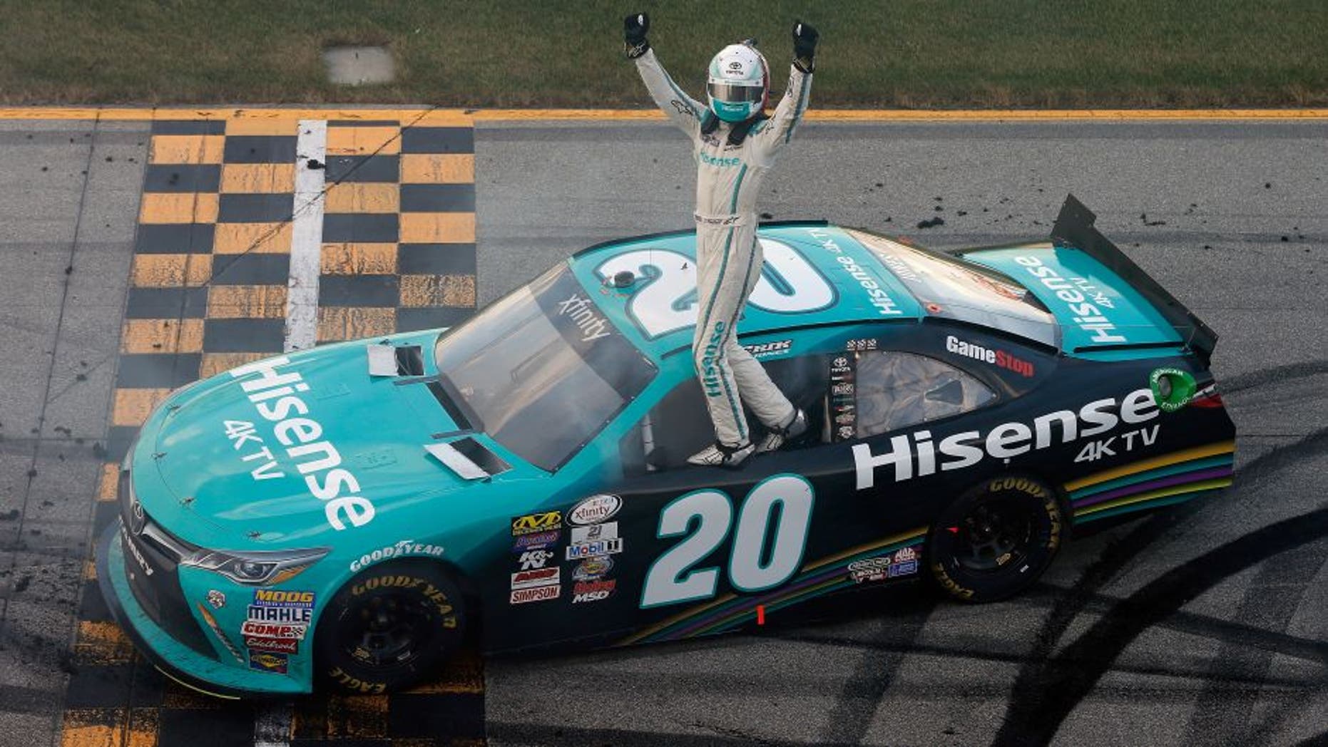 JOLIET, IL - SEPTEMBER 17: Erik Jones, driver of the #20 Hisense Toyota, celebrates after winning the NASCAR XFINITY Series Drive for Safety 300 at Chicagoland Speedway on September 17, 2016 in Joliet, Illinois. (Photo by Brian Lawdermilk/NASCAR via Getty Images)