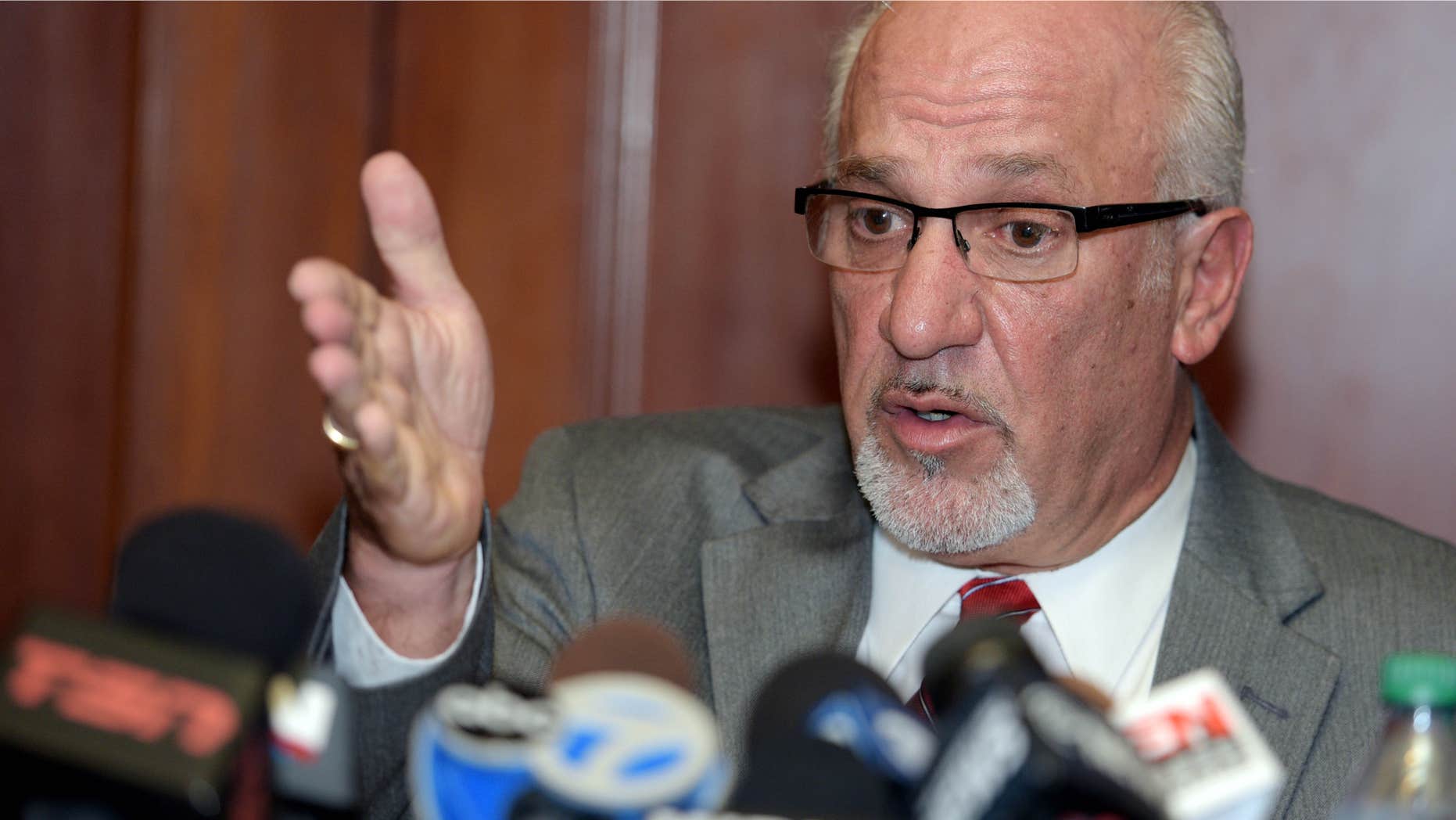 Sept. 23, 2015: Thomas J. Eoannou, a lawyer for a woman alleging she was sexually assaulted by Chicago Blackhawks forward Patrick Kane, gestures during a news conference in Buffalo, N.Y.