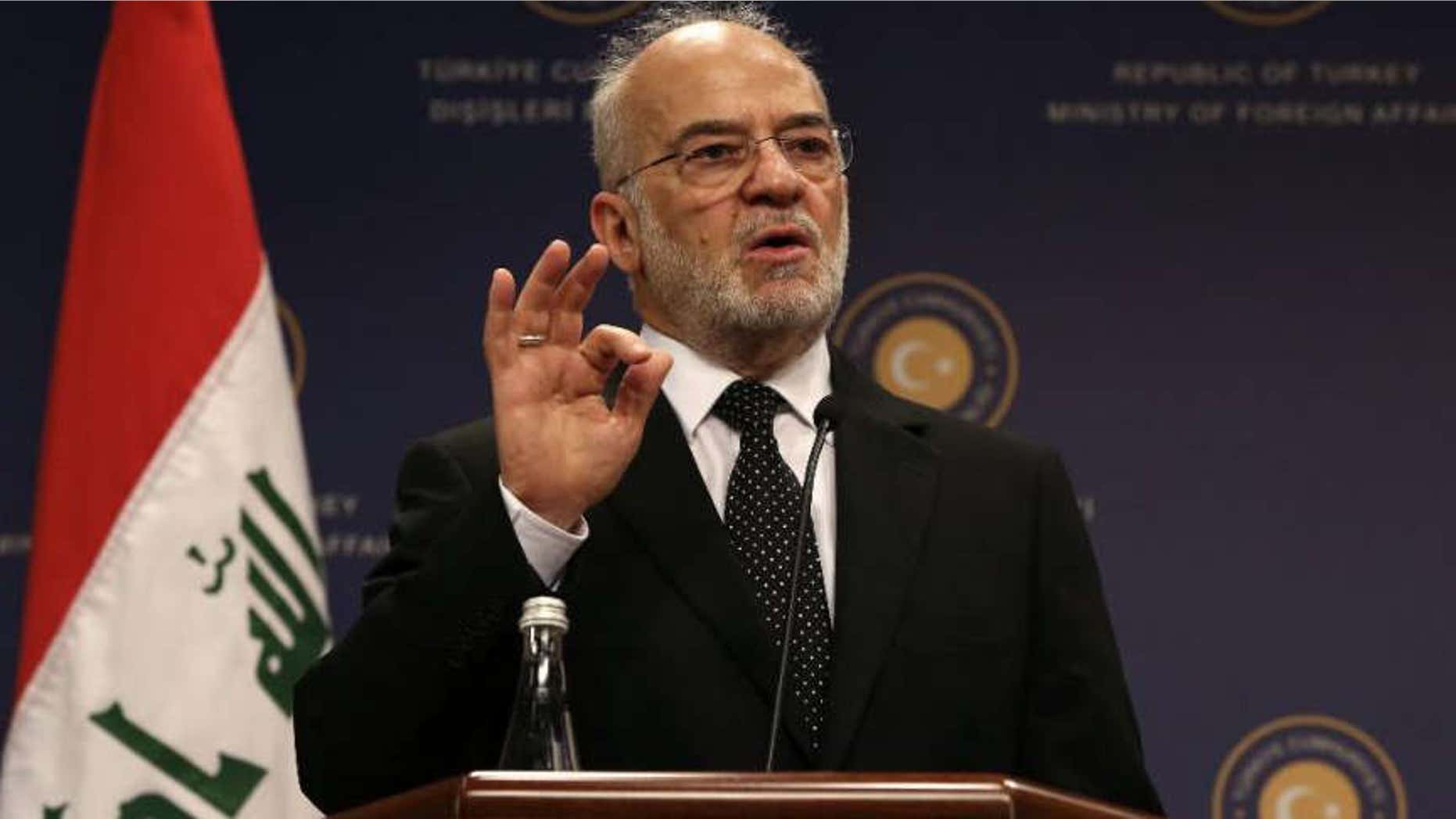 Iraqi Foreign Minister Ibrahim al-Jafari speaks to the media during a news conference with his Turkish counterpart Mevlut Cavusoglu after their talks in Ankara, Turkey, Wednesday, Nov. 5, 2014.