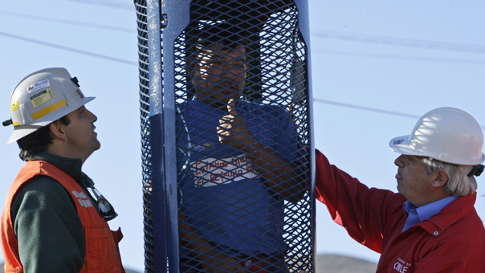 Sept. 25: Alberto Segovia, brother of trapped miner Dario Segovia, gives a thumbs up as he stands in the capsule that will be used to rescue trapped miners from the collapsed San Jose mine.