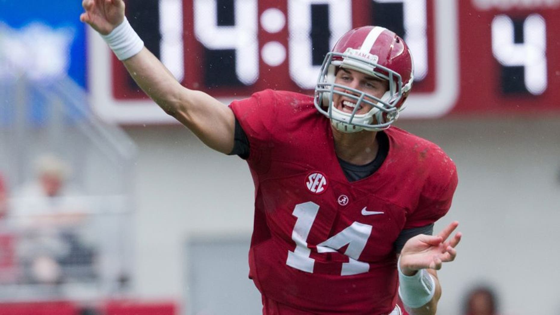 Sep 6, 2014; Tuscaloosa, AL, USA; Alabama Crimson Tide quarterback Jake Coker (14) passes against the Florida Atlantic Owls at Bryant-Denny Stadium. Mandatory Credit: Marvin Gentry-USA TODAY Sports