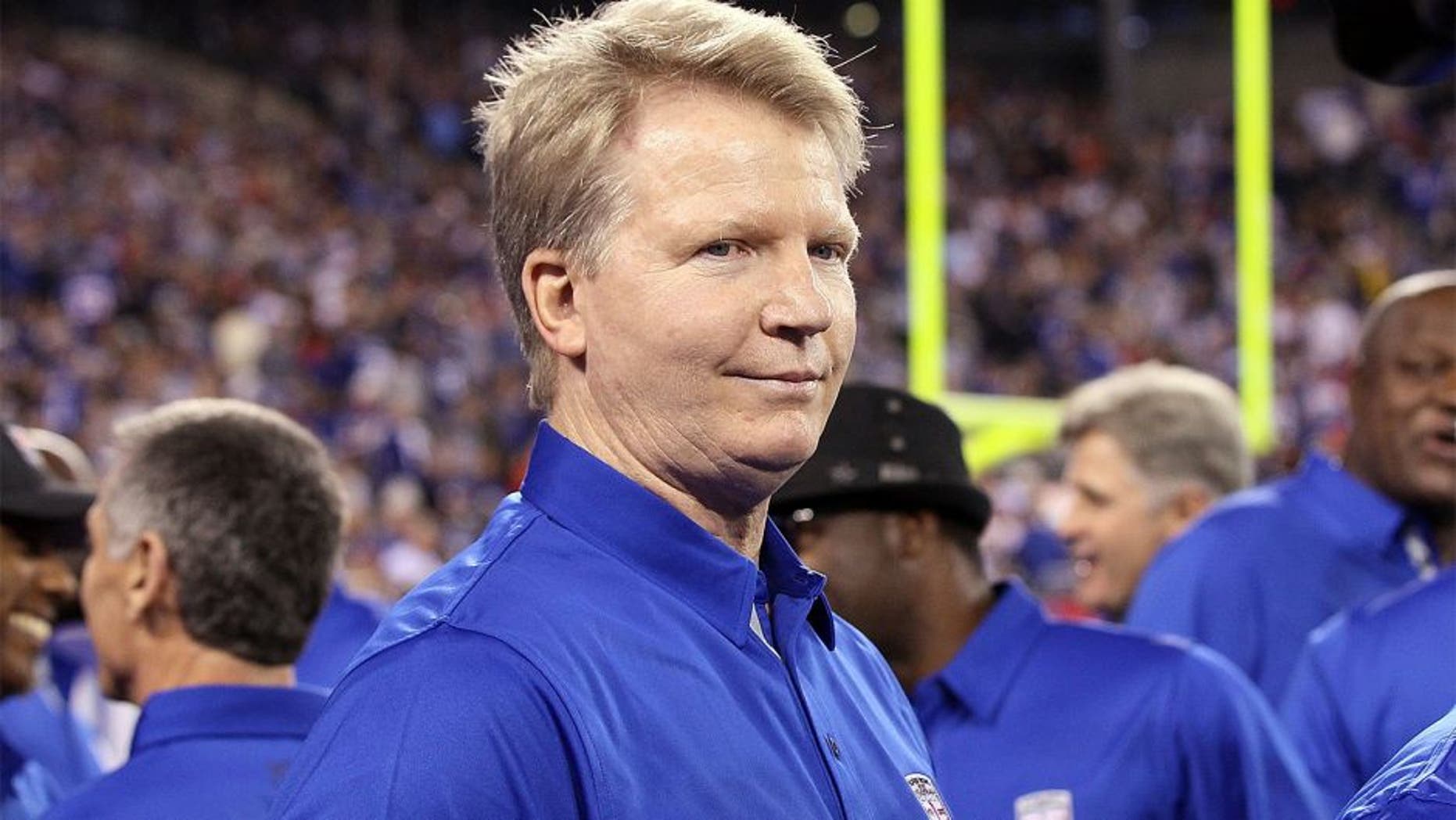 EAST RUTHERFORD, NJ - SEPTEMBER 19: (NEW YORK DAILIES OUT) Former Giant Phil Simms looks on at halftime as the 1986 New York Giants are honored on the 25th anniversary of their Super Bowl winning team on September 19, 2011 at MetLife Stadium in East Rutherford, New Jersey. The Giants defeated the Rams 28-16. (Photo by Jim McIsaac/Getty Images)