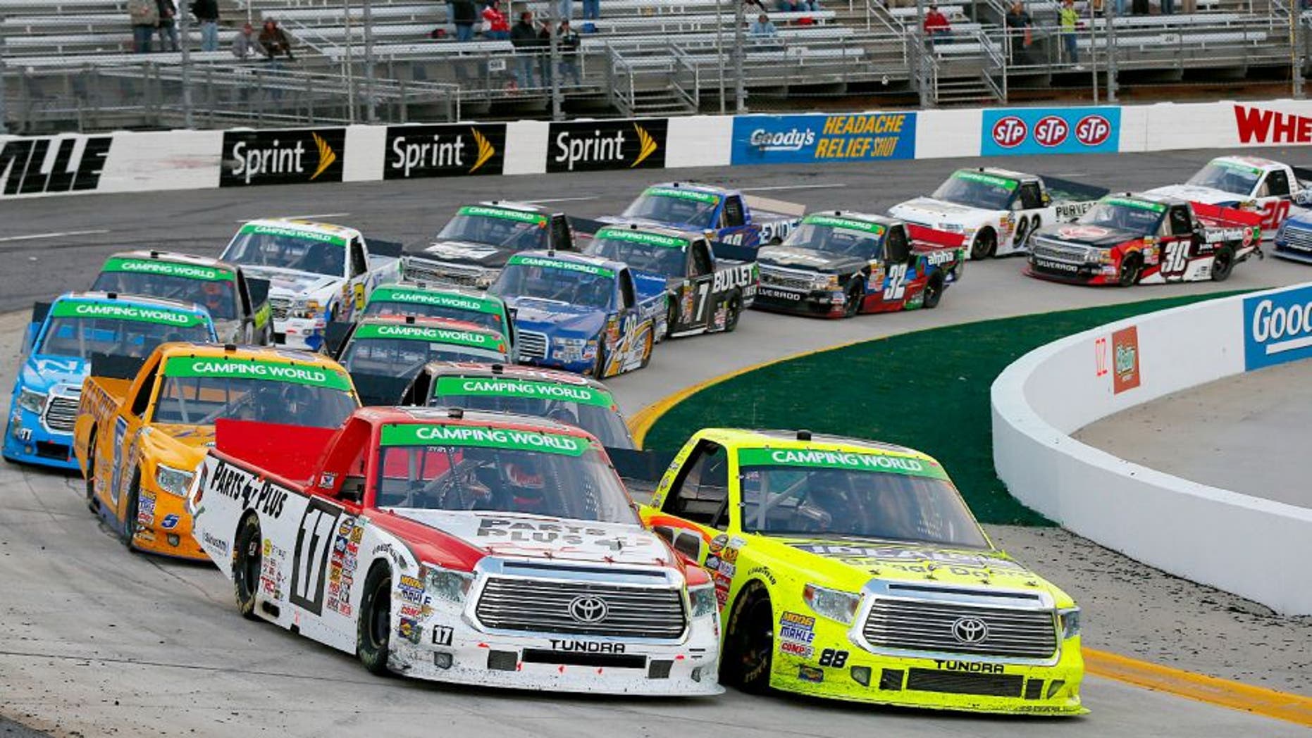MARTINSVILLE, VA - MARCH 30: Timothy Peters, driver of the #17 Parts Plus Toyota, and Matt Crafton, driver of the #88 Ideal Doors / Menards Toyota, lead the field to a restart during the NASCAR Camping World Truck Series Kroger 250 at Martinsville Speedway on March 30, 2014 in Martinsville, Virginia. (Photo by Matt Sullivan/Getty Images)