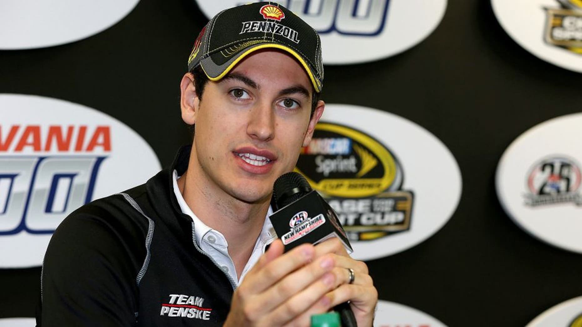LOUDON, NH - SEPTEMBER 25: Joey Logano, driver of the #22 Shell Pennzoil Ford, speaks with the media during practice for the NASCAR Sprint Cup Series Sylvania 300 at New Hampshire Motor Speedway on September 25, 2015 in Loudon, New Hampshire. (Photo by Todd Warshaw/NASCAR via Getty Images)