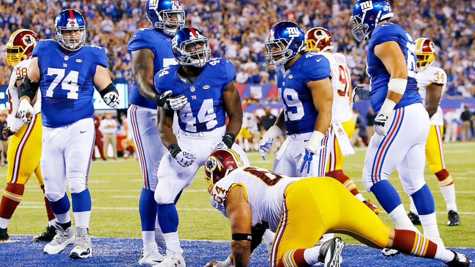 EAST RUTHERFORD, NJ - SEPTEMBER 24: Andre Williams #44 of the New York Giants celebrates his first quarter touchdown against the Washington Redskins at MetLife Stadium on September 24, 2015 in East Rutherford, New Jersey. (Photo by Al Bello/Getty Images)