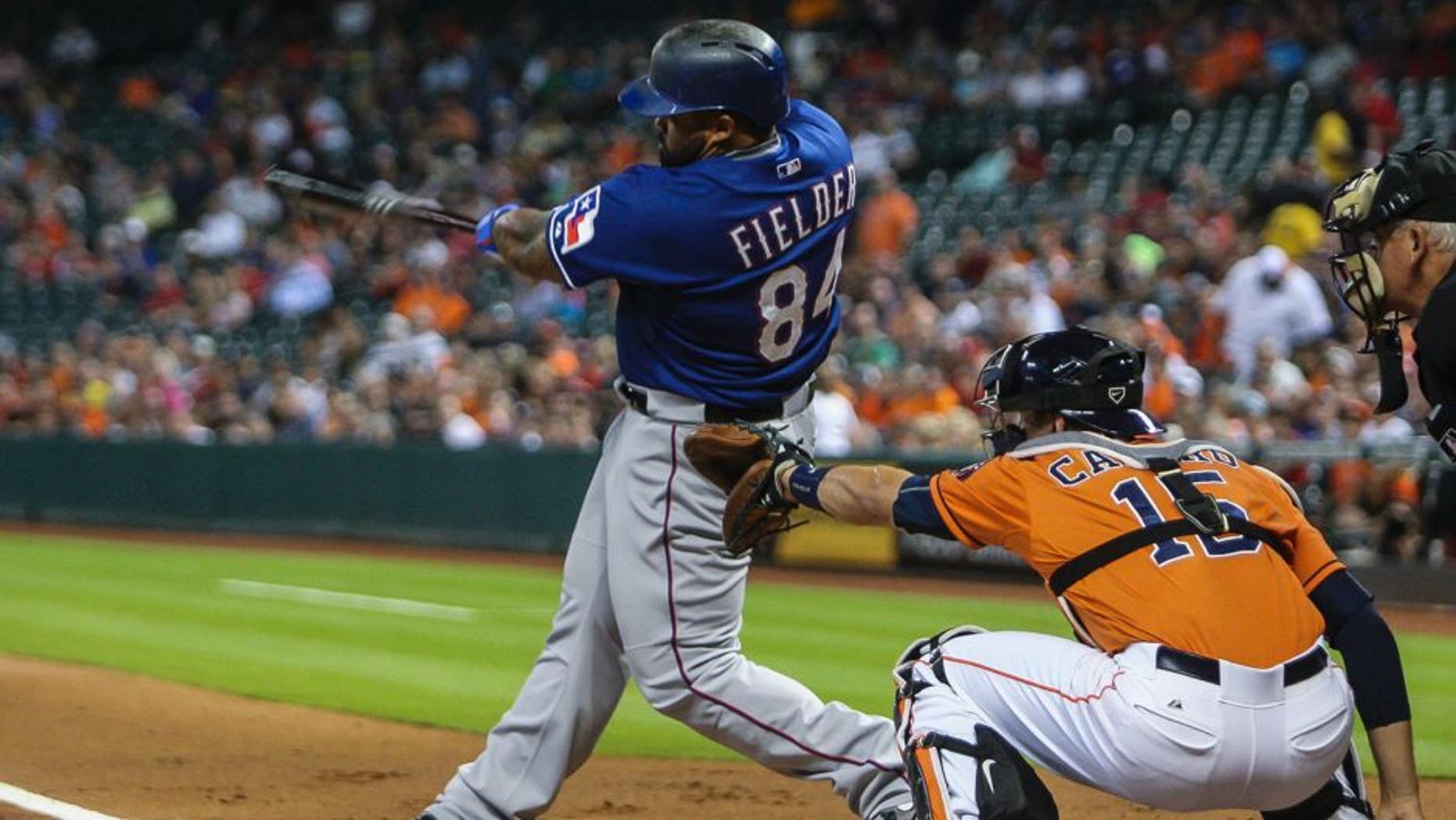 Sep 25, 2015; Houston, TX, USA; Texas Rangers designated hitter Prince Fielder (84) hits an RBI double during the first inning against the Houston Astros at Minute Maid Park. Mandatory Credit: Troy Taormina-USA TODAY Sports