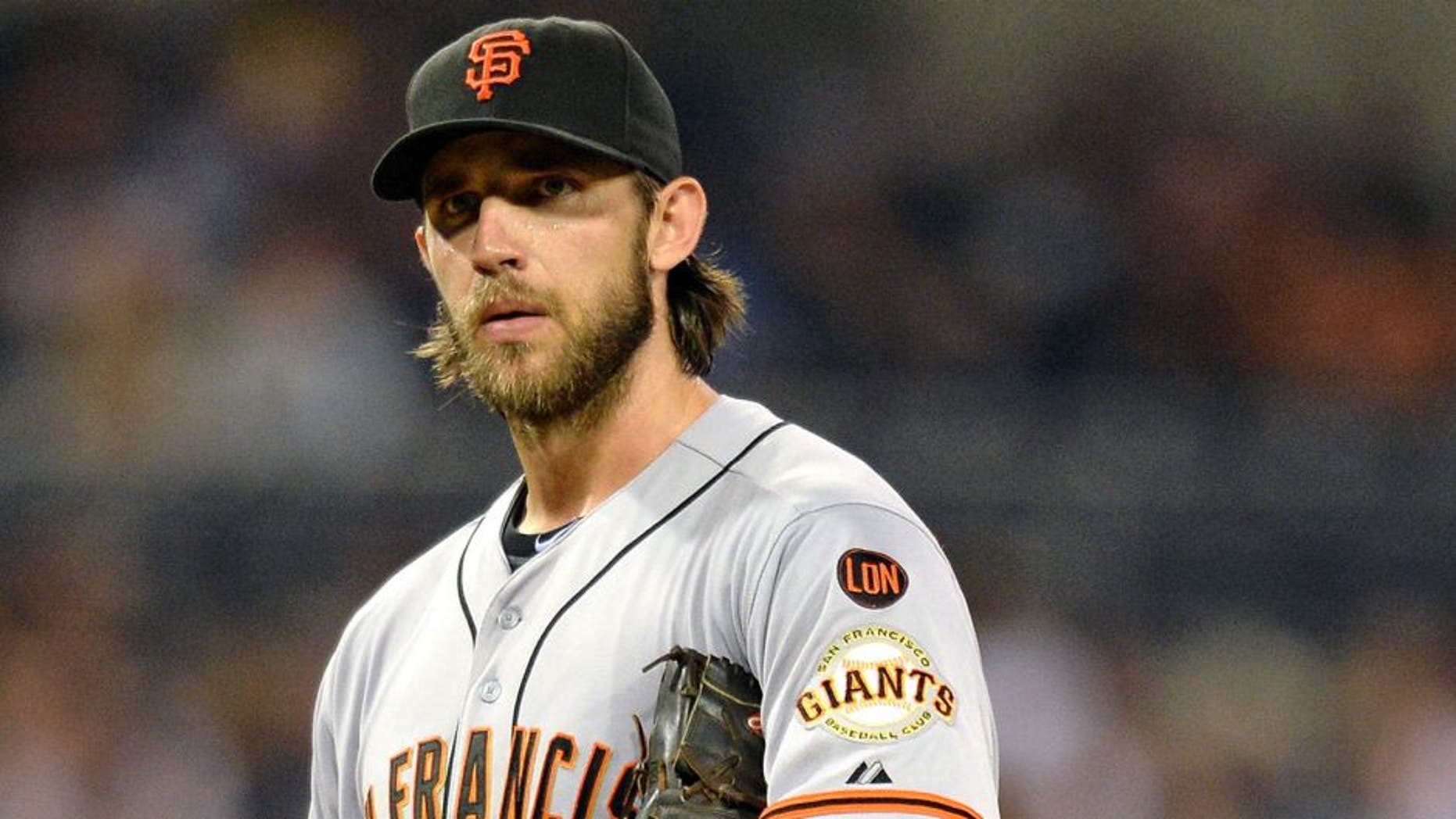 Sep 24, 2015; San Diego, CA, USA; San Francisco Giants starting pitcher Madison Bumgarner (40) looks to the San Diego Padres dugout after right fielder Matt Kemp (not pictured) yelled from the dugout at Petco Park. Mandatory Credit: Jake Roth-USA TODAY Sports