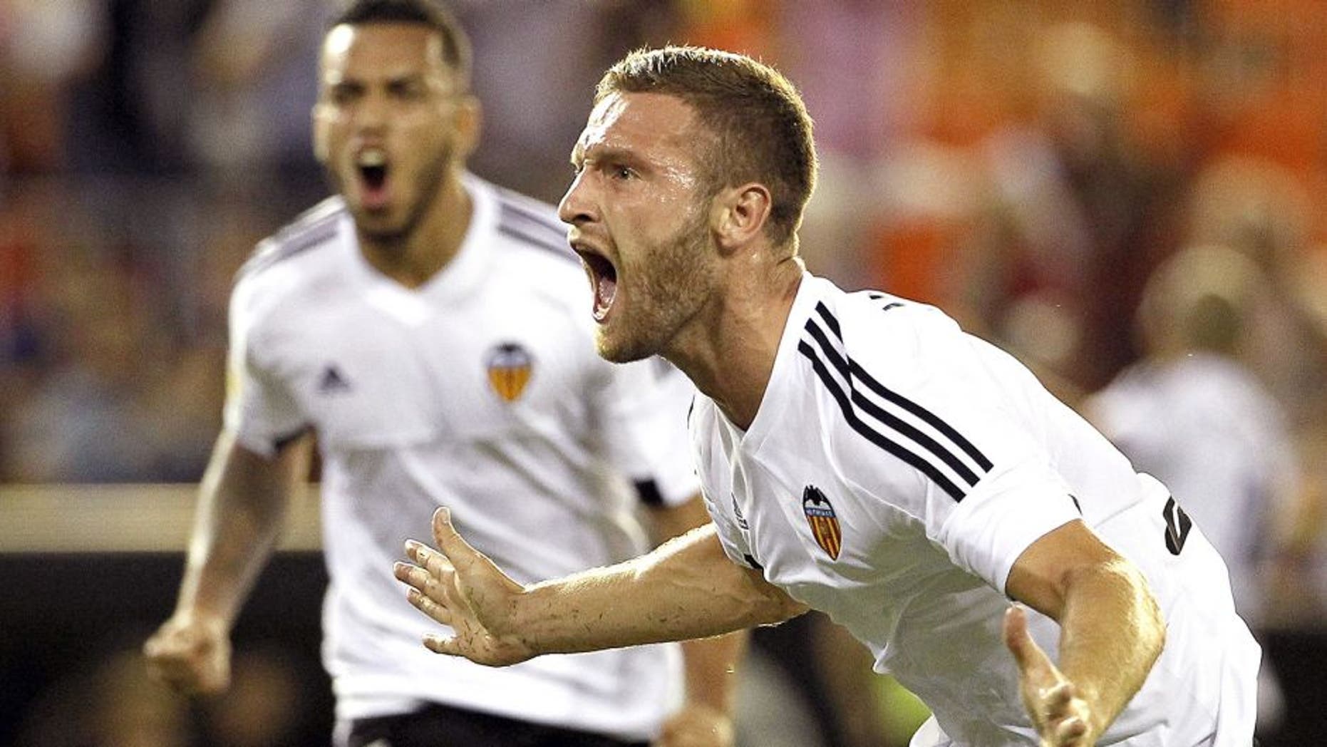 Valencia's German defender Shkodran Mustafi celebrates his goal during the Spanish league football match Valencia CF vs Granada CF at the Mestalla stadium in Valencia on September 25, 2015. AFP PHOTO / JOSE JORDAN (Photo credit should read JOSE JORDAN/AFP/Getty Images)