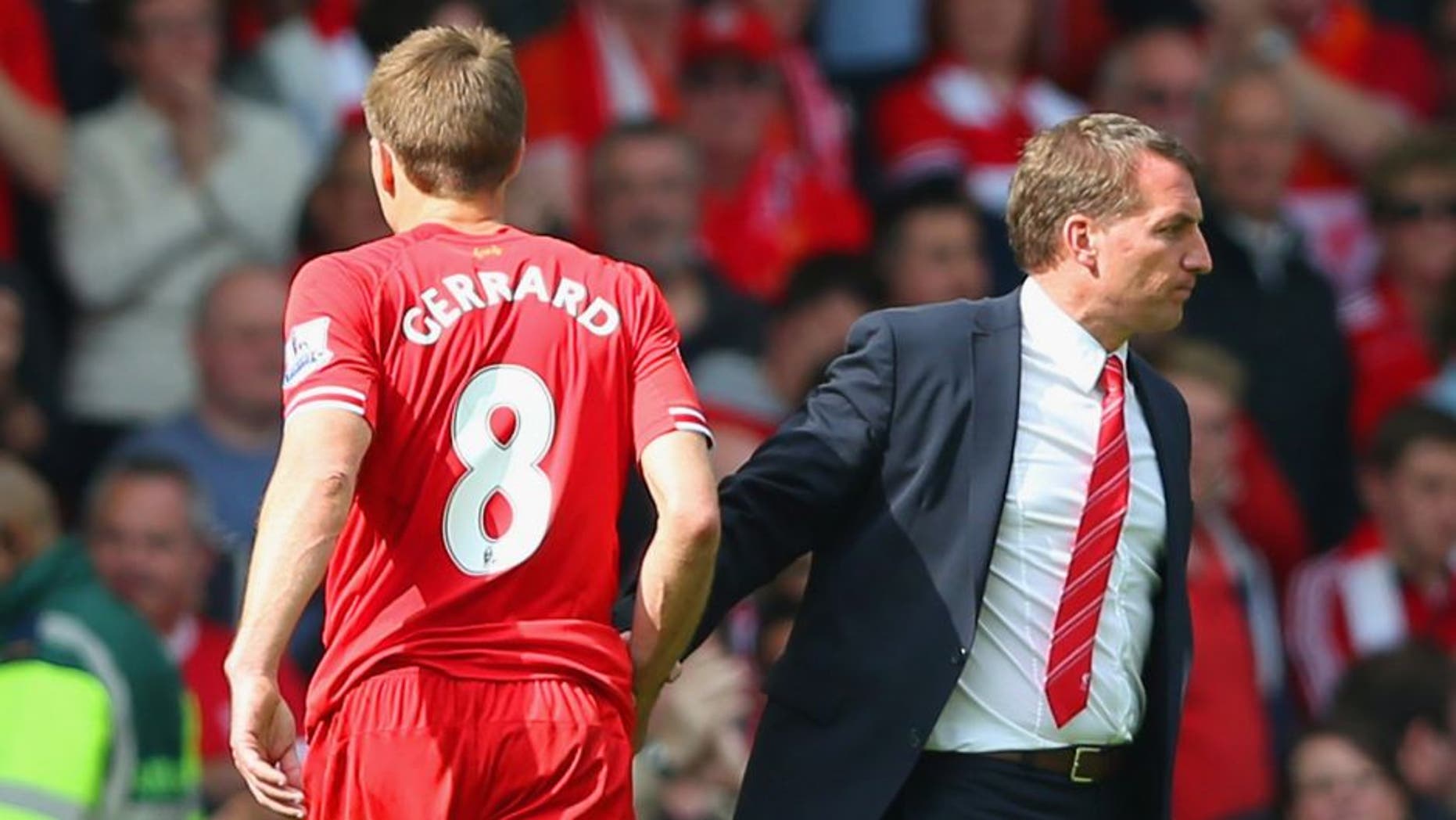 LIVERPOOL, ENGLAND - APRIL 27: Steven Gerrard of Liverpool shakes hands with Manager Brendan Rodgers of Liverpool at the end of the match during the Barclays Premier League match between Liverpool and Chelsea at Anfield on April 27, 2014 in Liverpool, England. (Photo by Clive Brunskill/Getty Images)