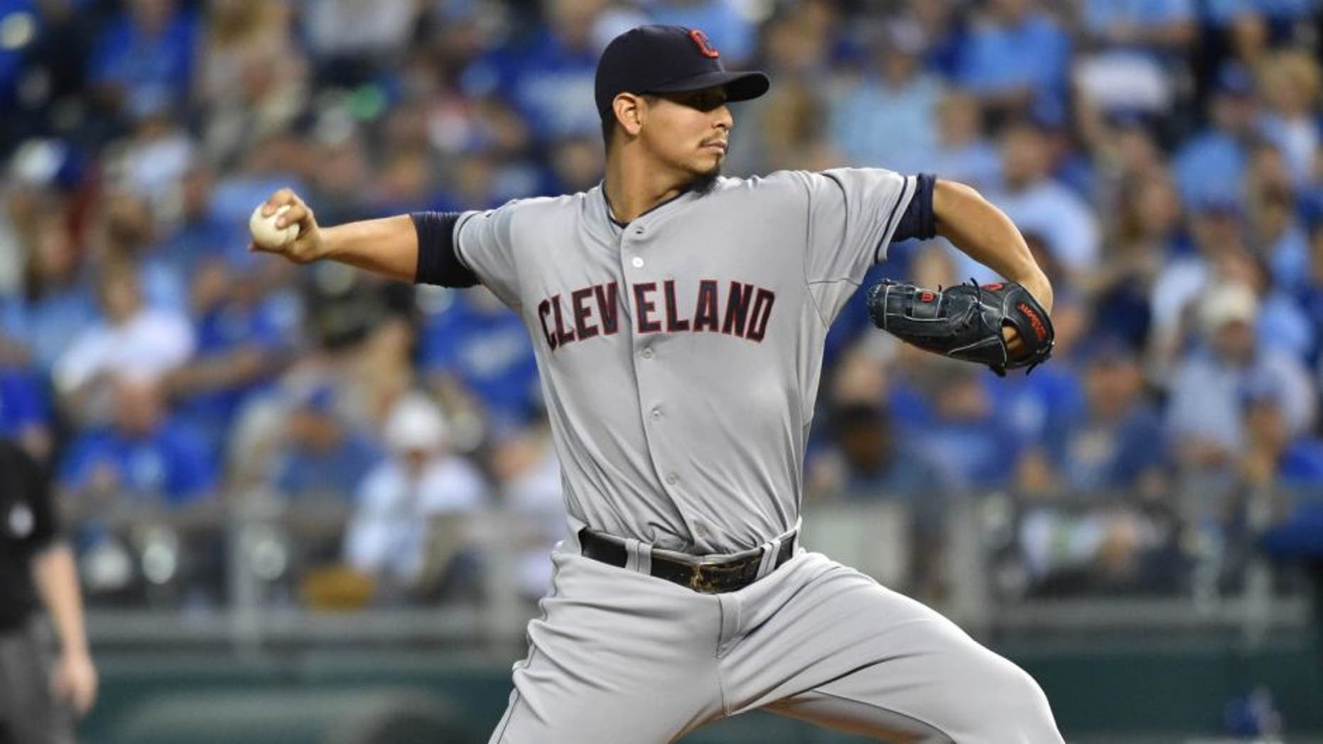 Cleveland Indians pitcher Carlos Carrasco delivers a pitch against the Kansas City Royals during the first inning at Kauffman Stadium.