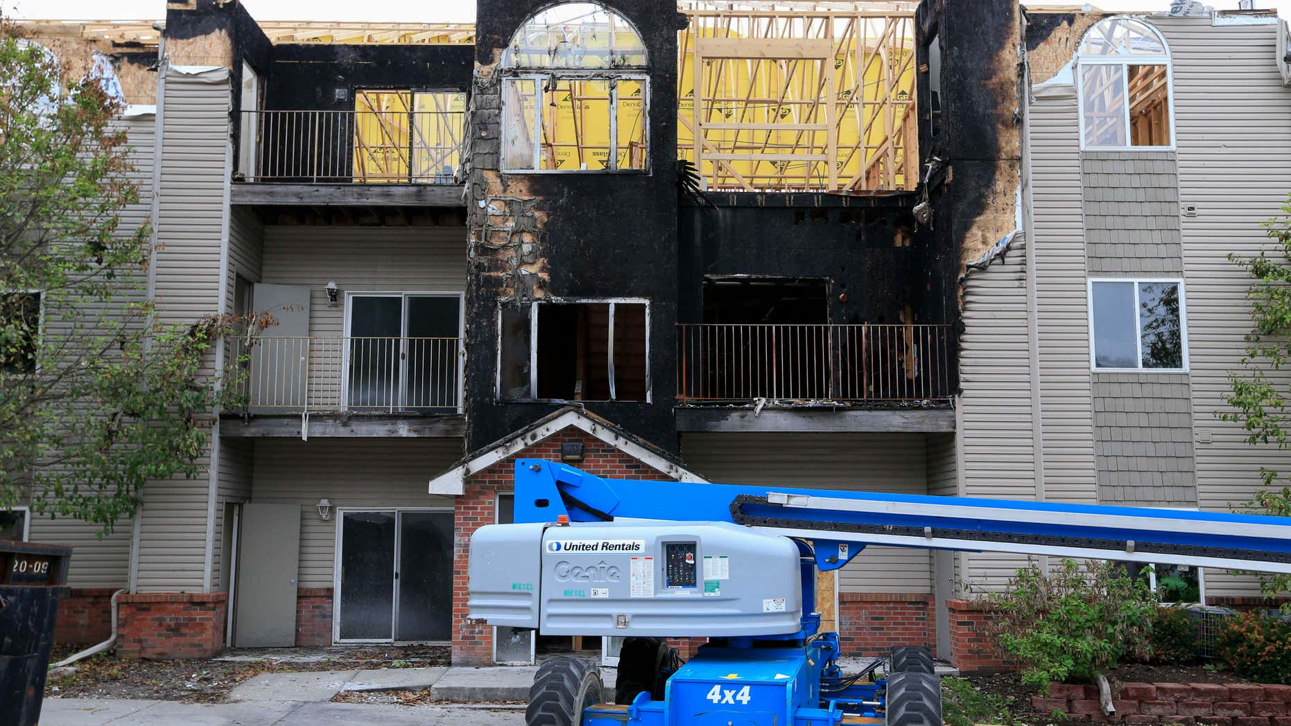 In this Sept. 14, 2016, photo, restoration work is performed at a Bellevue, Neb., apartment complex which was hit twice by fire.