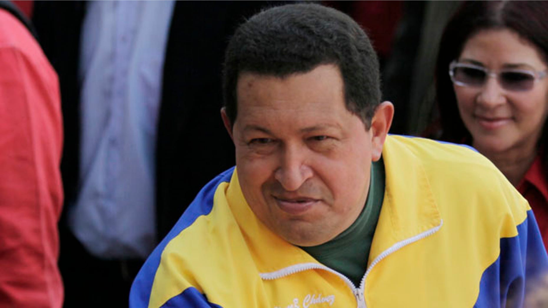 Sept. 26: Venezuela's President Hugo Chavez greets supporters upon his arrival to a polling station during congressional elections in Caracas, Venezuela.