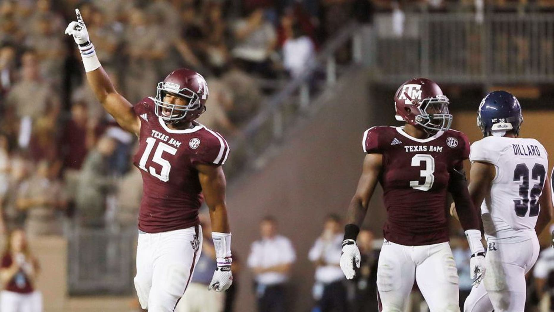 Sep 13, 2014; College Station, TX, USA; Texas A&M Aggies defensive lineman Myles Garrett (15) reacts against the Rice Owls during the second half at Kyle Field. Mandatory Credit: Soobum Im-USA TODAY Sports