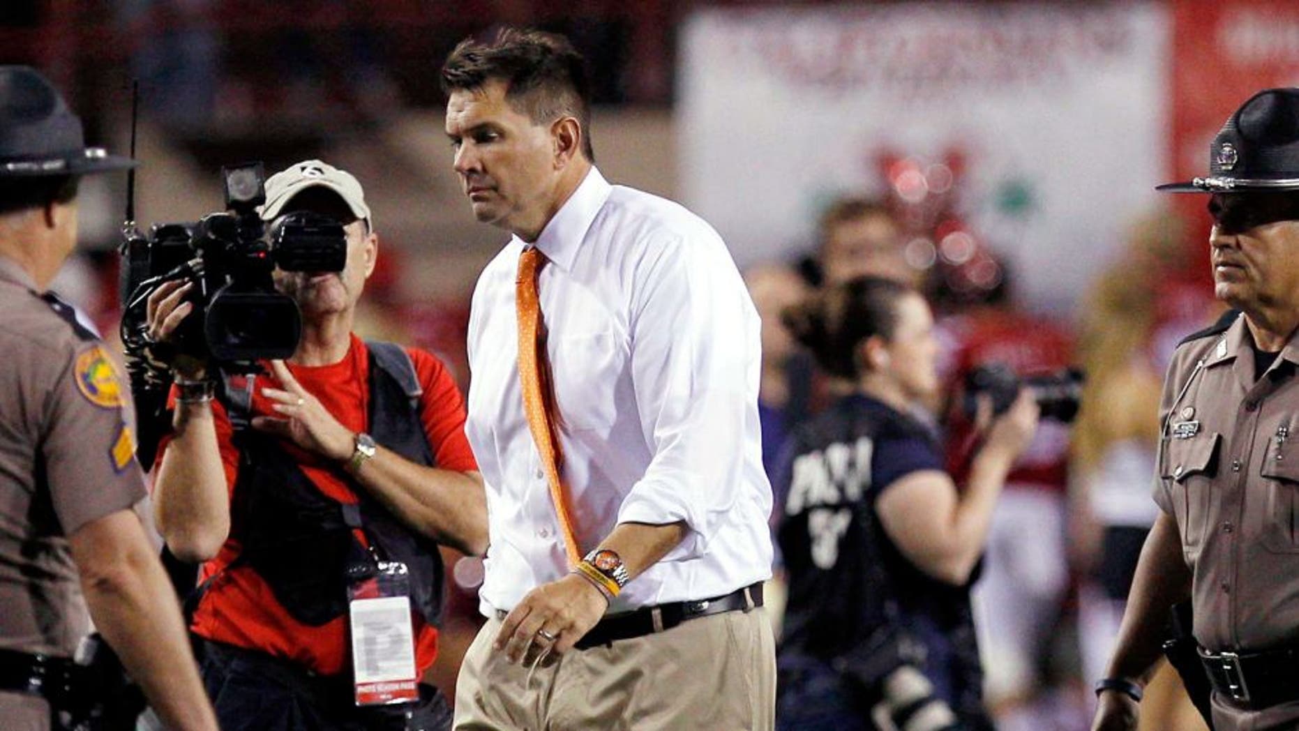 Sep 20, 2014; Lincoln, NE, USA; Miami Hurricanes head coach Al Golden leaves the field after losing to the Nebraska Cornhuskers at Memorial Stadium. Nebraska won 41-31. Mandatory Credit: Bruce Thorson-USA TODAY Sports