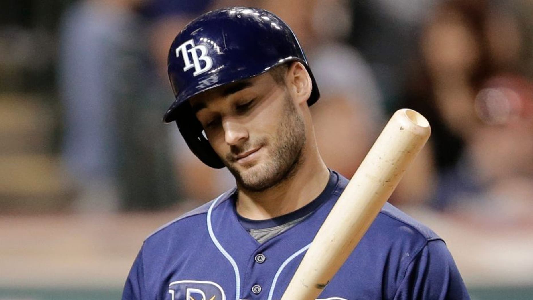 Tampa Bay Rays' Kevin Kiermaier reacts after striking out to Cleveland Indians starting pitcher Corey Kluber in the third inning of a baseball game, Friday, Sept. 26, 2014, in Cleveland. (AP Photo/Tony Dejak)