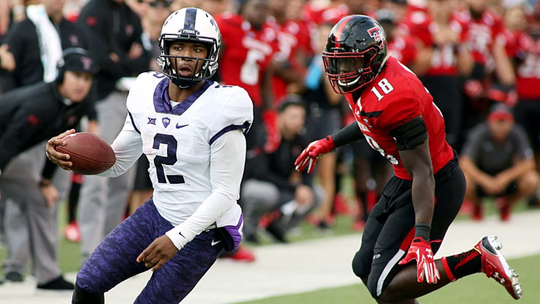 Sep 26, 2015; Lubbock, TX, USA; Texas Christian University Horned Frogs quarterback Trevone Boykin (2) looks for running room against the Texas Tech Red Raiders in the second half at Jones AT&T Stadium. TCU defeated Texas Tech 55-52. Mandatory Credit: Michael C. Johnson-USA TODAY Sports