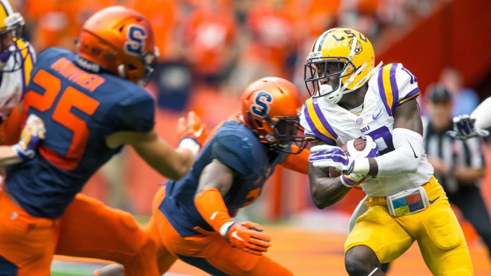SYRACUSE, NY - SEPTEMBER 26: Tre'Davious White #18 of the LSU Tigers carries the ball during the first quarter against the Syracuse Orange on September 26, 2015 at The Carrier Dome in Syracuse, New York. (Photo by Brett Carlsen/Getty Images)