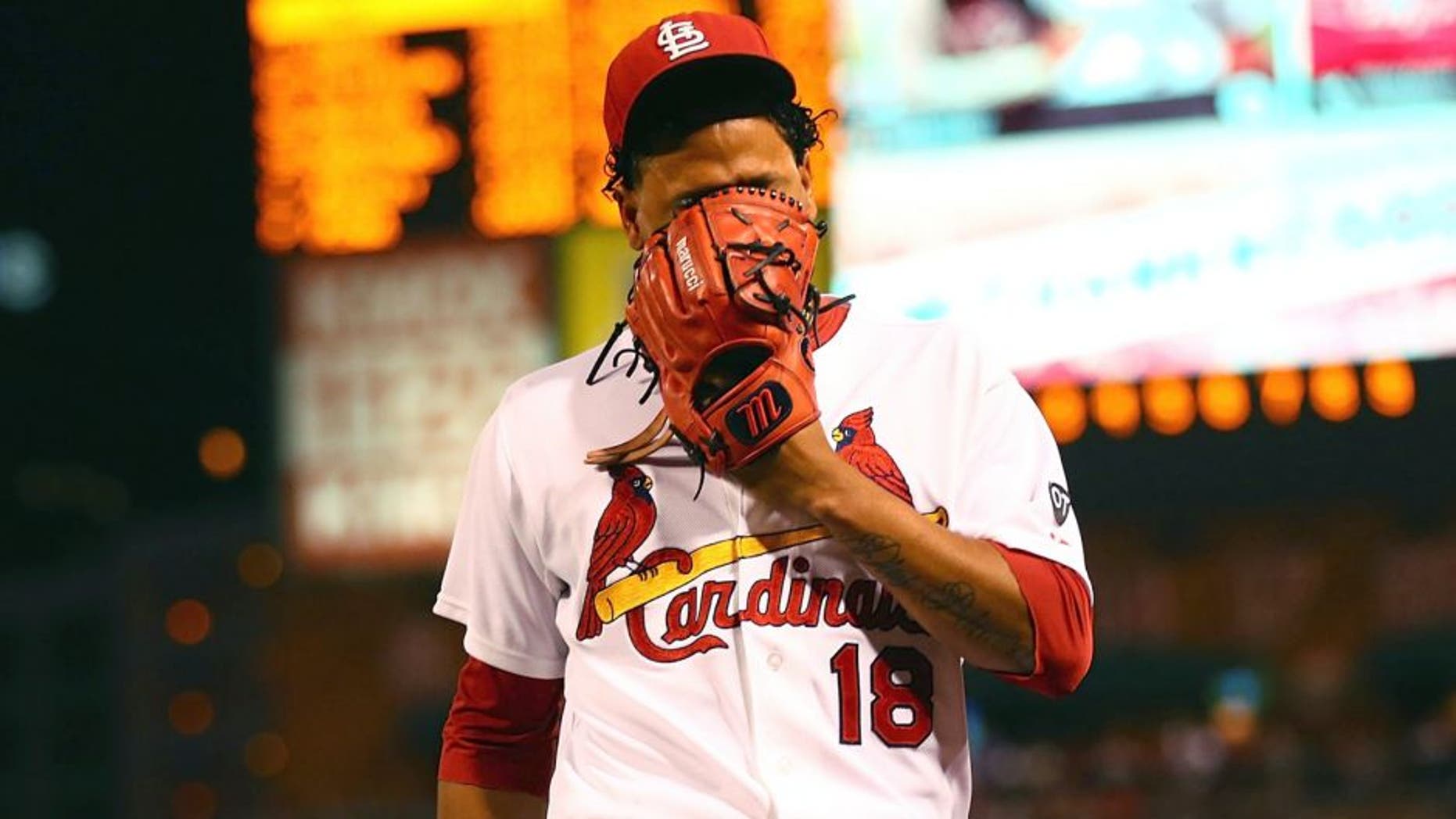 ST. LOUIS, MO - SEPTEMBER 25: Starter Carlos Martinez #18 of the St. Louis Cardinals reacts after being pulled from the game against the Milwaukee Brewers due to shoulder tightness in the first inning at Busch Stadium on September 25, 2015 in St. Louis, Missouri. (Photo by Dilip Vishwanat/Getty Images)