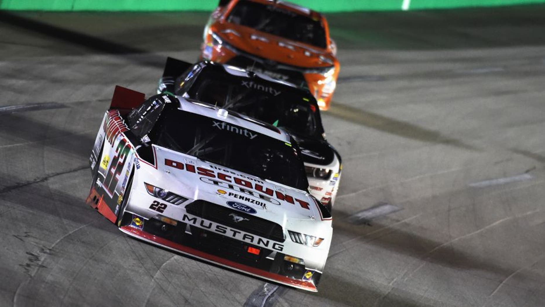 SPARTA, KY - SEPTEMBER 26: Ryan Blaney, driver of the #22 Discount Tire Ford, leads Brian Scott, driver of the #2 Shore Lodge Chevrolet, and Daniel Suarez, driver of the #18 ARRIS Toyota, during the NASCAR Xfinity Series Visitmyrtlebeach.com 300 at Kentucky Speedway on September 26, 2015 in Sparta, Kentucky. (Photo by Rainier Ehrhardt/NASCAR via Getty Images)