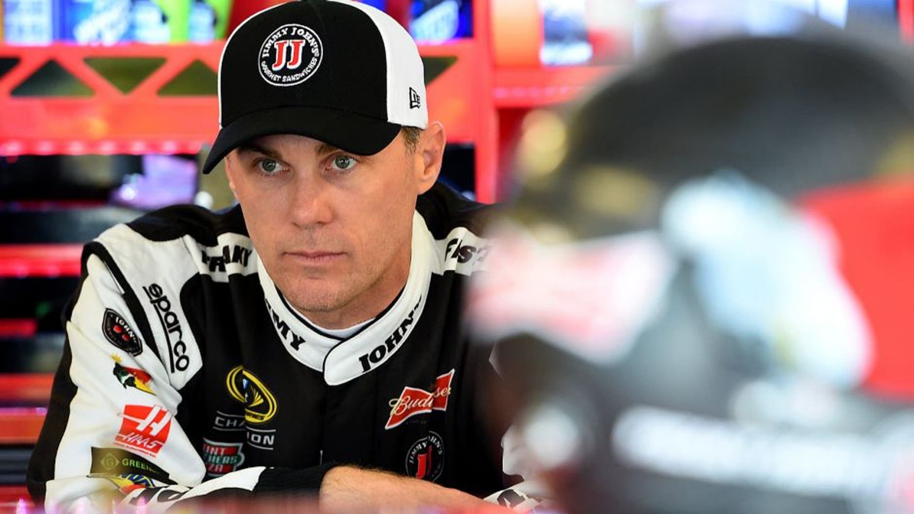 JOLIET, IL - SEPTEMBER 18: Kevin Harvick, driver of the #4 Jimmy John's / Budweiser Chevrolet, stands in the garage area before practice for the NASCAR Sprint Cup Series myAFibRisk.com 400 at Chicagoland Speedway on September 18, 2015 in Joliet, Illinois. (Photo by Josh Hedges/Getty Images)