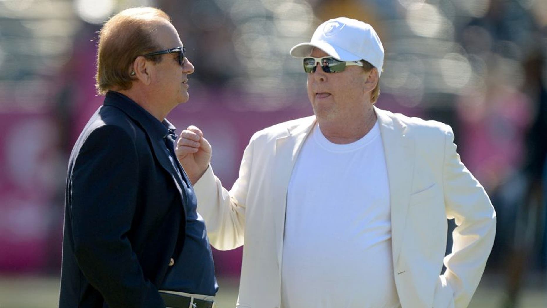 Oct 12, 2014; Oakland, CA, USA; San Diego Chargers president Dean Spanos (left) and Oakland Raiders owner Mark Davis before the game at O.co Coliseum. Mandatory Credit: Kirby Lee-USA TODAY Sports