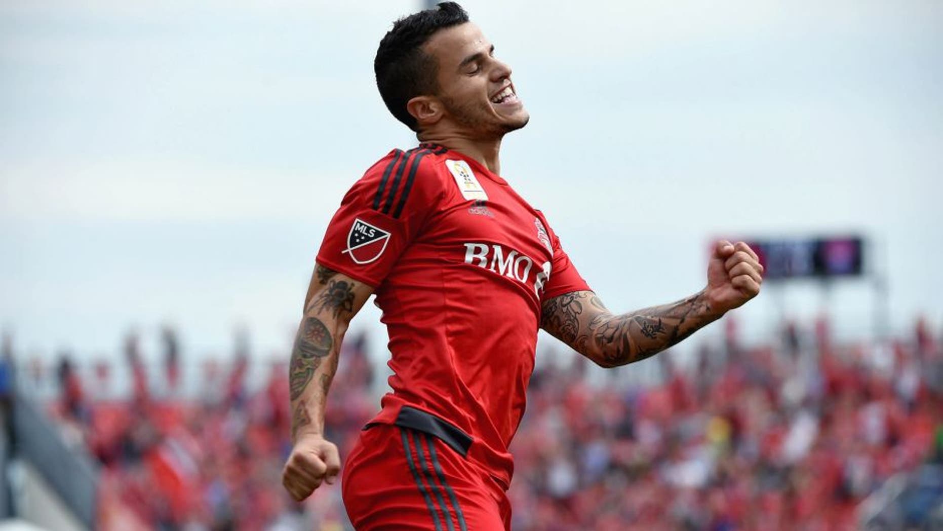 Sep 19, 2015; Toronto, Ontario, CAN; Toronto FC forward Sebastian Giovinco (10) reacts after scoring his second goal against Colorado Rapids in the first half at BMO Field. Mandatory Credit: Dan Hamilton-USA TODAY Sports