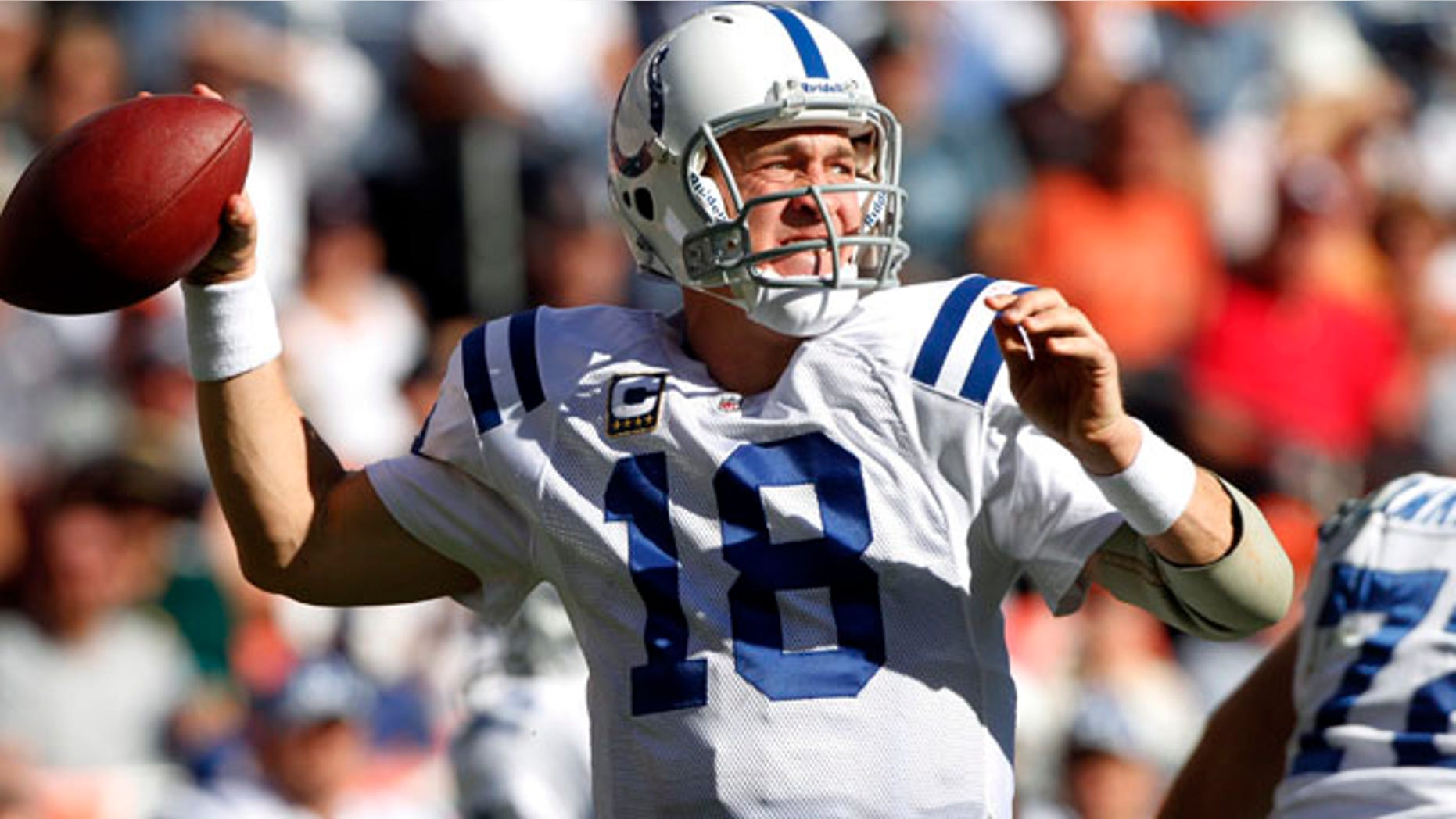 Indianapolis Colts quarterback Peyton Manning looks for a receiver during the second half of an NFL football game against the Denver Broncos on Sunday, Sept. 26, 2010, in Denver. The Colts won 27-13. (AP Photo/Barry Gutierrez)