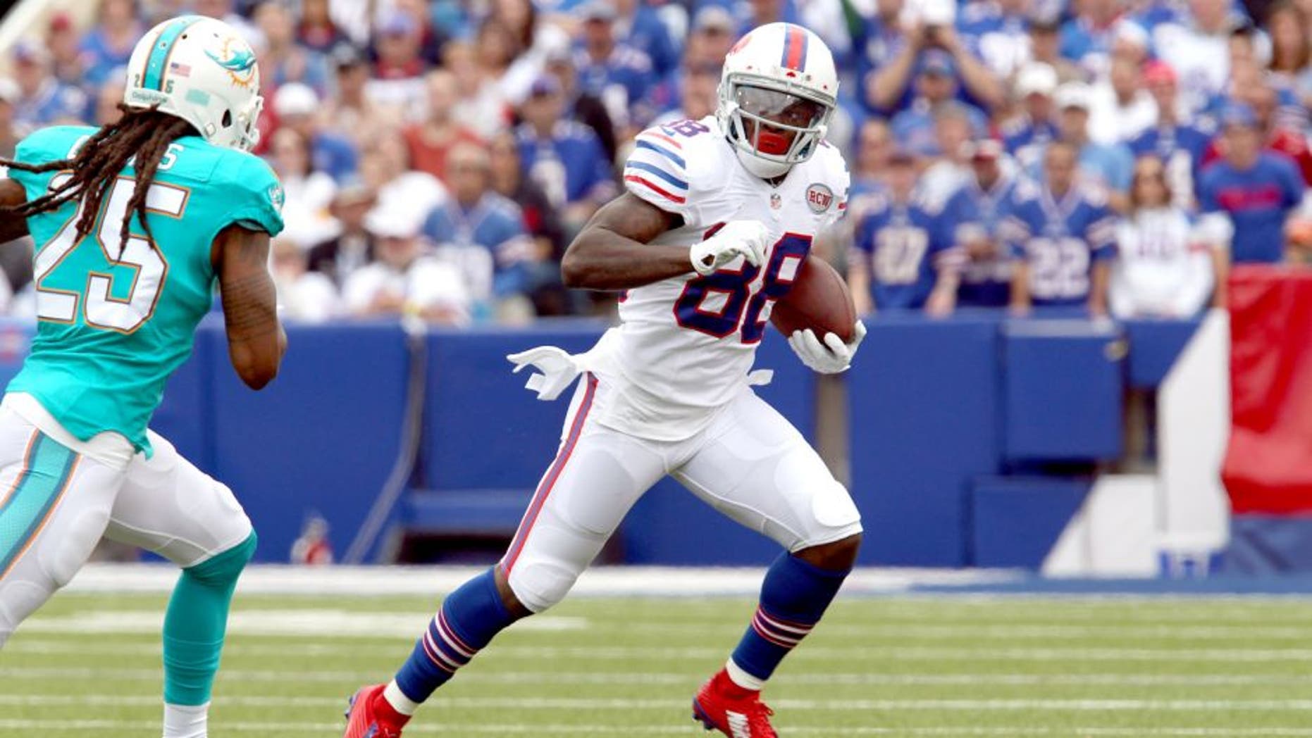 Sep 14, 2014; Orchard Park, NY, USA; Buffalo Bills wide receiver Marquise Goodwin (88) runs the ball after a catch against the Miami Dolphins at Ralph Wilson Stadium. Mandatory Credit: Timothy T. Ludwig-USA TODAY Sports