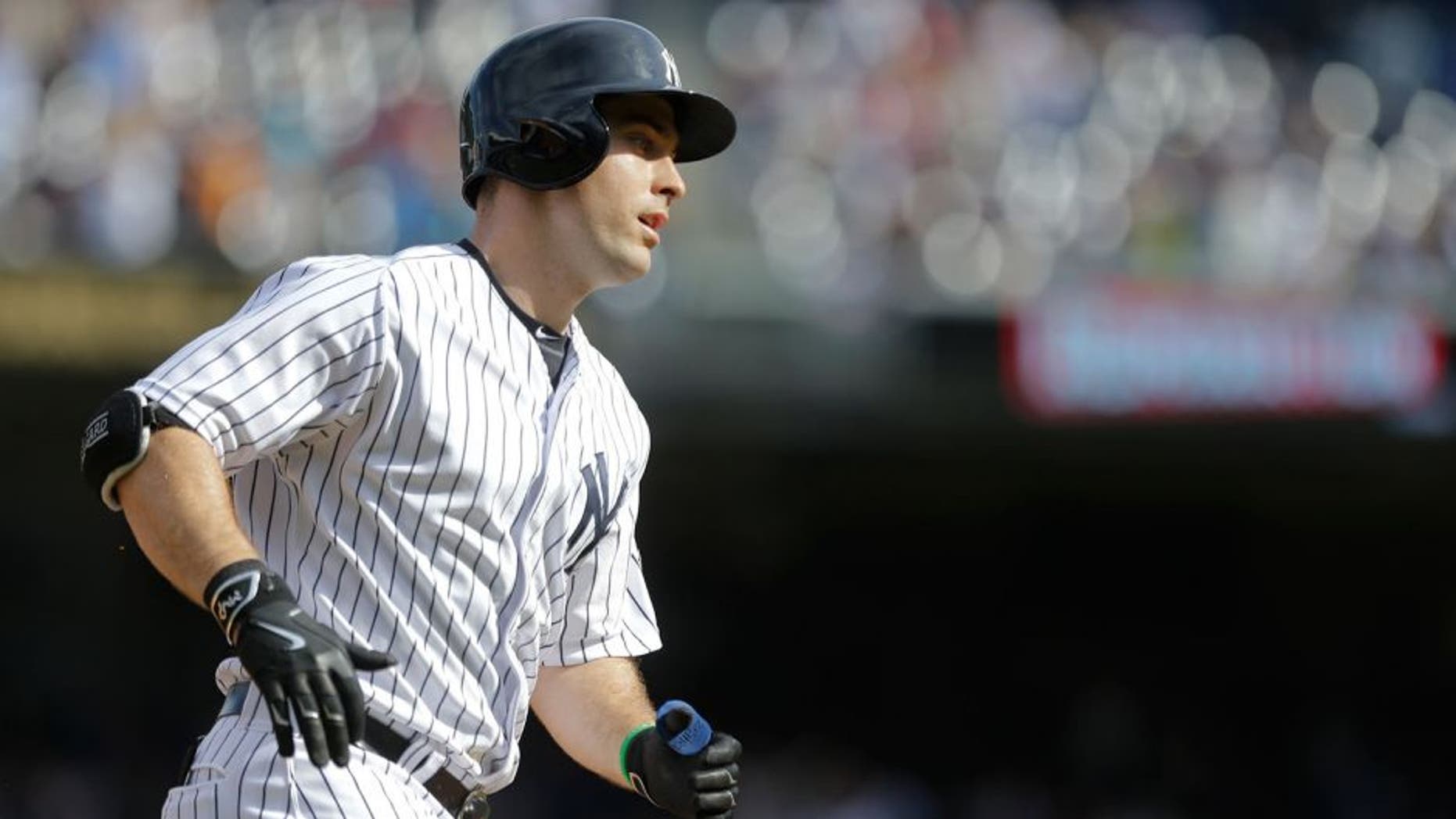 New York Yankees' Dustin Ackley heads to home plate after hitting a home run during the sixth inning of a baseball game against the Chicago White Sox, Sunday, Sept. 27, 2015, in New York. (AP Photo/Frank Franklin II)