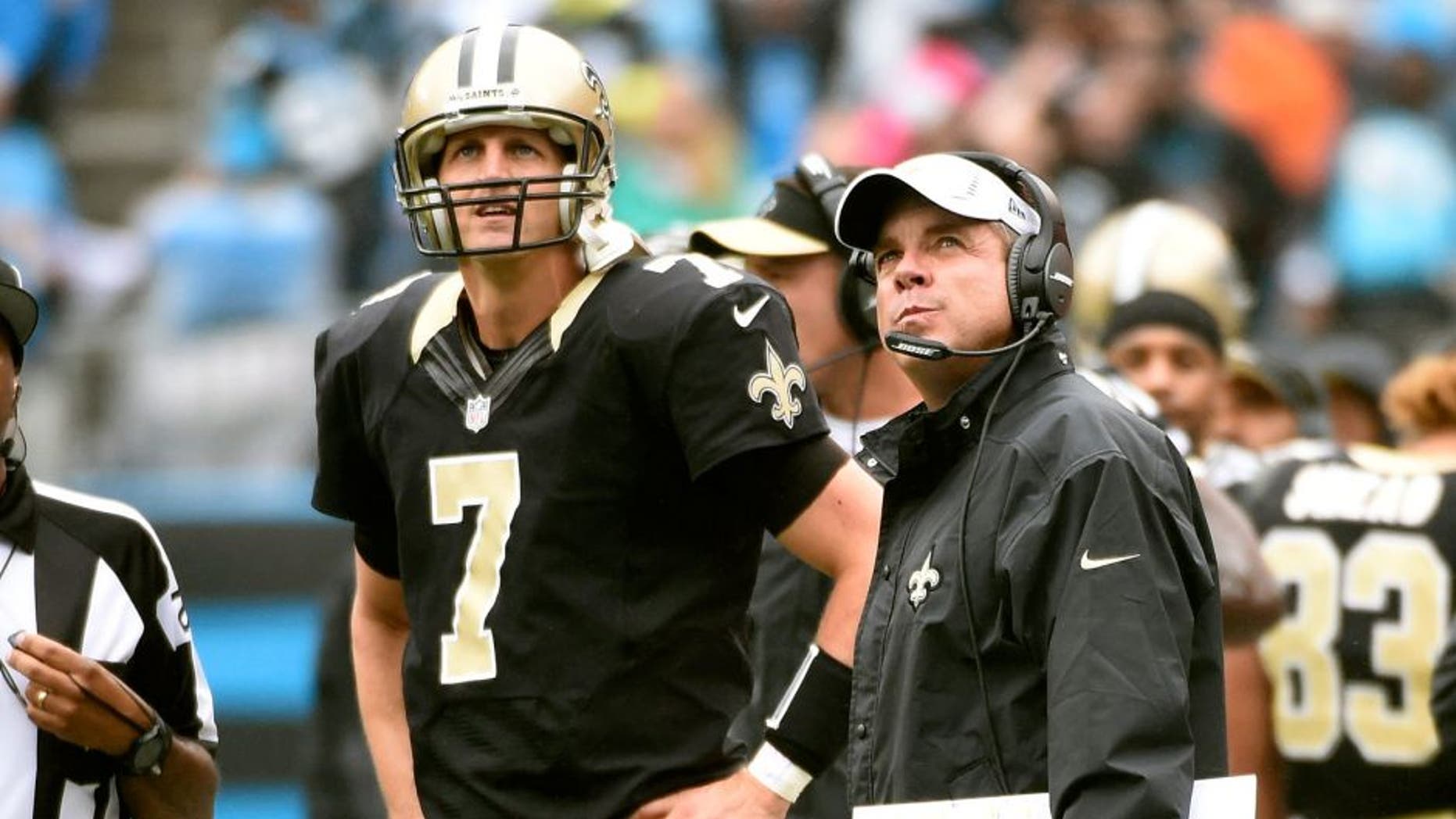 Sep 27, 2015; Charlotte, NC, USA; New Orleans Saints quarterback Luke McCown (7) and head coach Sean Payton on the sidelines in the fourth quarter. The Panthers defeated the Saints 27-22 at Bank of America Stadium. Mandatory Credit: Bob Donnan-USA TODAY Sports