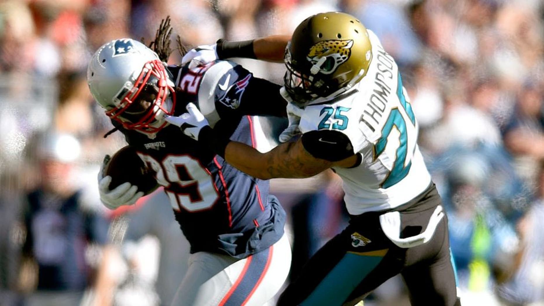 Sep 27, 2015; Foxborough, MA, USA; New England Patriots running back LeGarrette Blount (29) carries the ball as Jacksonville Jaguars defensive back Peyton Thompson (25) defends in the third quarter at Gillette Stadium. New England defeated Jacksonville 51-17. Mandatory Credit: James Lang-USA TODAY Sports
