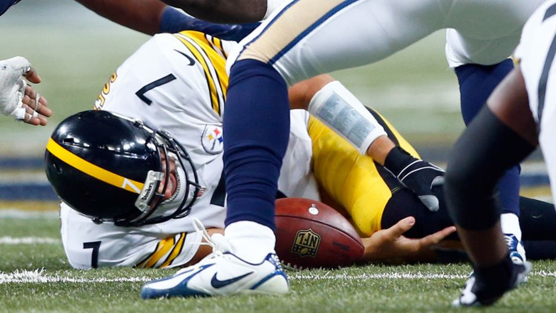 Pittsburgh Steelers quarterback Ben Roethlisberger holds his leg after being injured during the third quarter of an NFL football game against the St. Louis Rams, Sunday, Sept. 27, 2015, in St. Louis. (AP Photo/Billy Hurst)