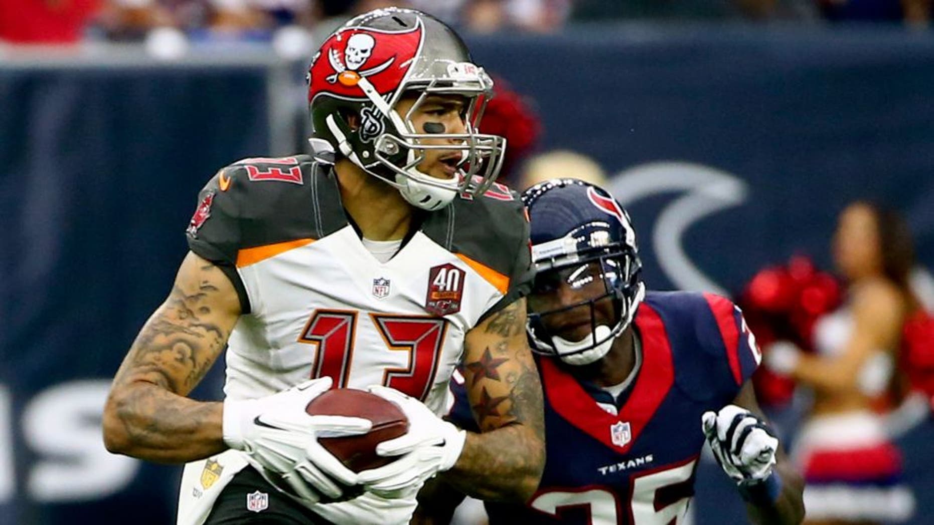 Sep 27, 2015; Houston, TX, USA; Tampa Bay Buccaneers wide receiver Mike Evans (13) runs with the ball as Houston Texans cornerback Kareem Jackson (25) defends during the game at NRG Stadium. Houston won 19-9. Mandatory Credit: Kevin Jairaj-USA TODAY Sports