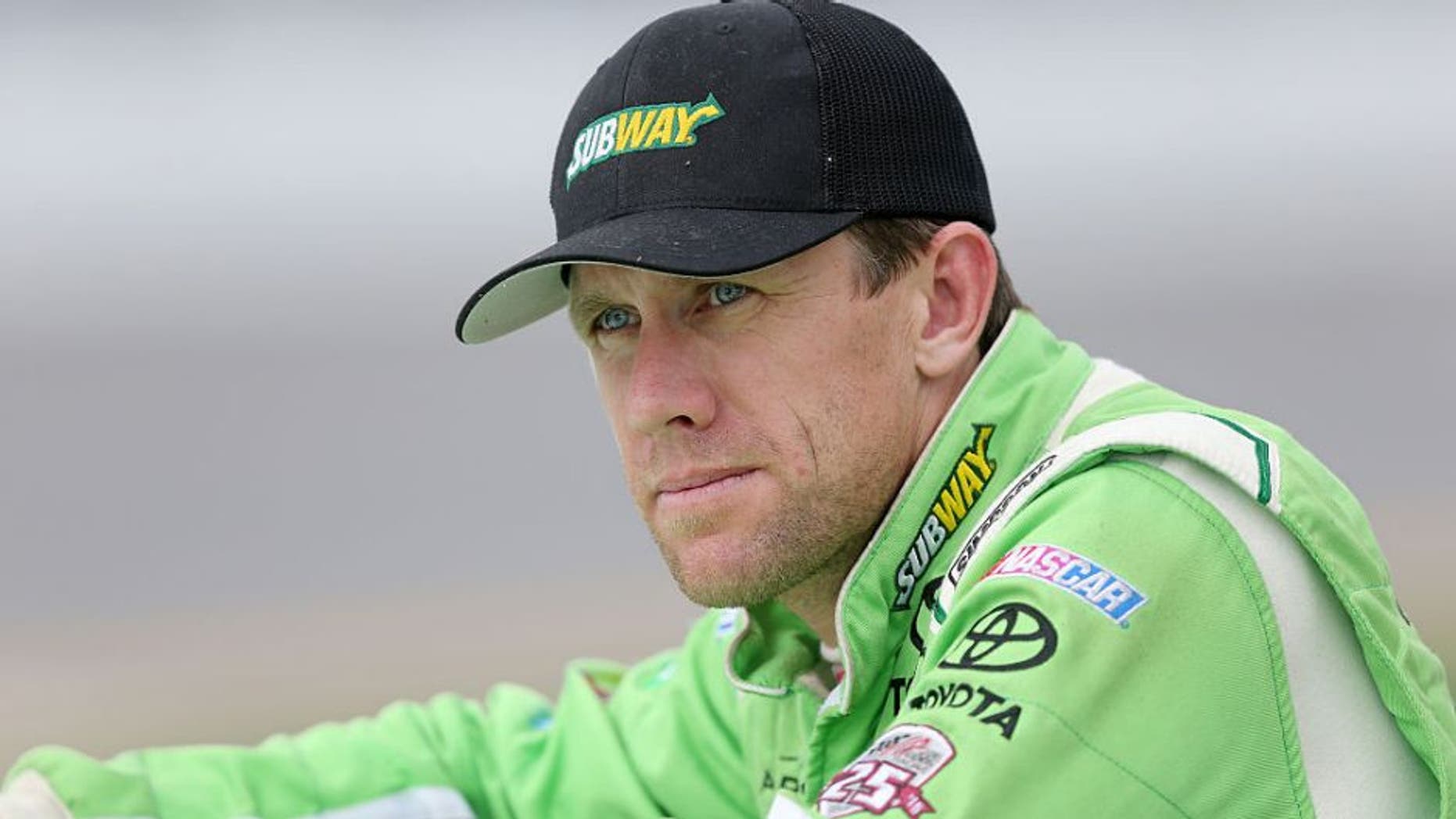 DAYTONA BEACH, FL - JULY 01: Carl Edwards, driver of the #19 Subway Toyota, stands on the grid during qualifying for the NASCAR Sprint Cup Series Coke Zero 400 at Daytona International Speedway on July 1, 2016 in Daytona Beach, Florida. (Photo by Jerry Markland/Getty Images)
