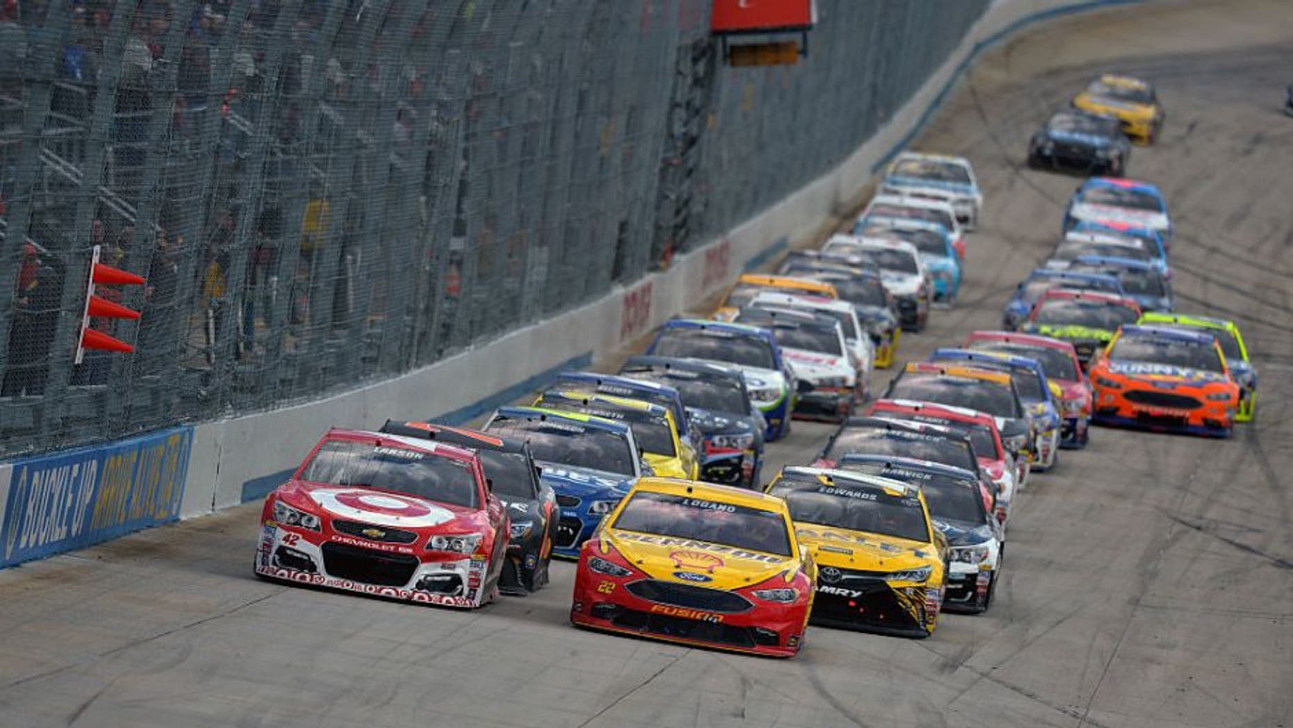 DOVER, DE - MAY 15: Kyle Larson, driver of the #42 Target Chevrolet, and Joey Logano, driver of the #22 Shell Pennzoil Ford, lead the pack during the NASCAR Sprint Cup Series AAA 400 Drive for Autism at Dover International Speedway on May 15, 2016 in Dover, Delaware. (Photo by Drew Hallowell/NASCAR via Getty Images)