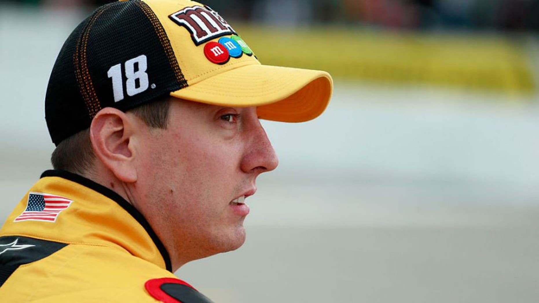 LOUDON, NH - SEPTEMBER 23: Kyle Busch, driver of the #18 M&M's Core Toyota, stands on the grid during qualifying for the NASCAR Sprint Cup Series Bad Boy Off Road 300 at New Hampshire Motor Speedway on September 23, 2016 in Loudon, New Hampshire. (Photo by Matt Sullivan/Getty Images)