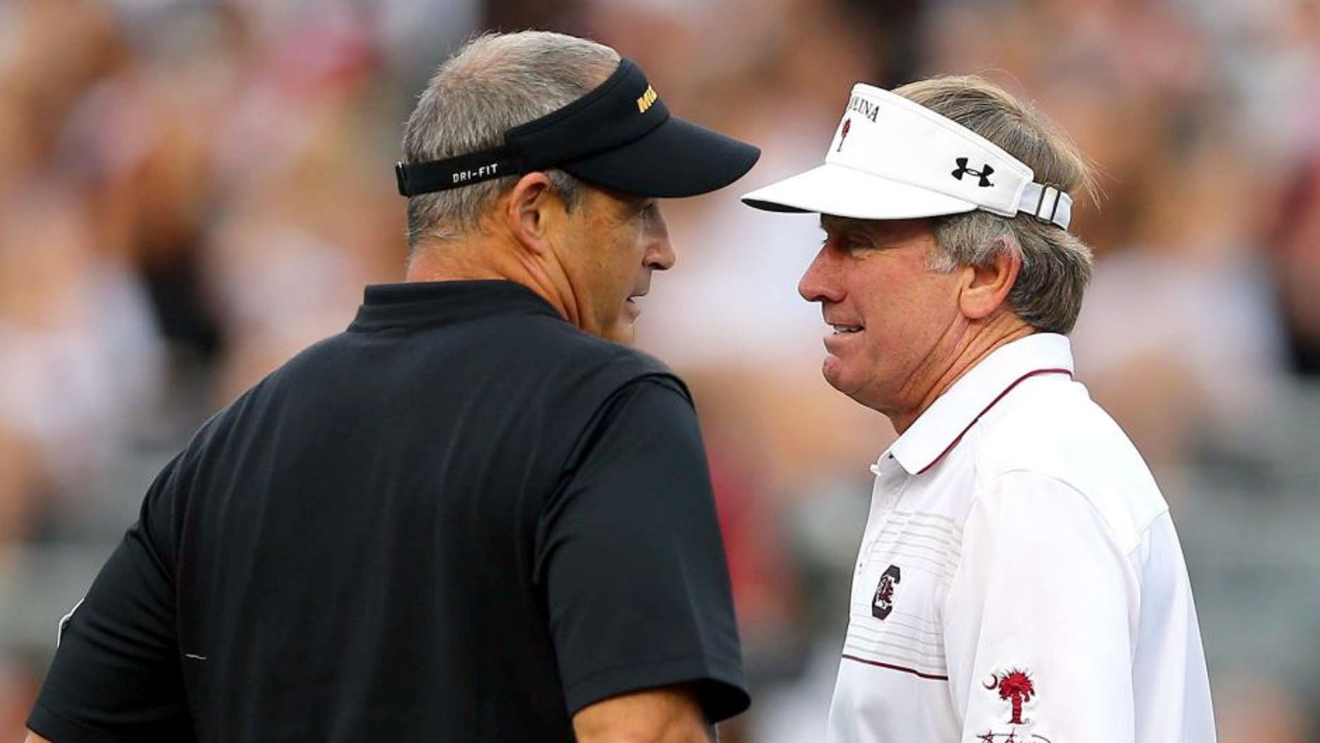 Sep 27, 2014; Columbia, SC, USA; South Carolina Gamecocks head coach Steve Spurrier and Missouri Tigers head coach Gary Pinkel meet before the game at Williams-Brice Stadium. Mandatory Credit: Jim Dedmon-USA TODAY Sports