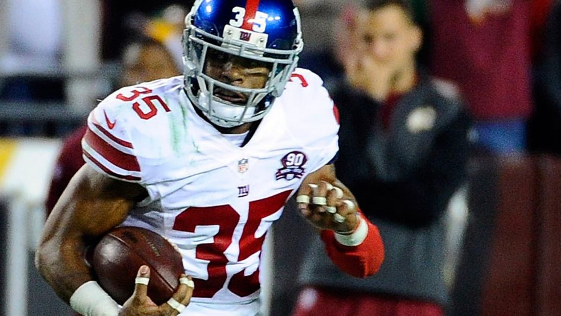 Sep 25, 2014; Landover, MD, USA; New York Giants free safety Quintin Demps (35) runs with the ball after an interception against the Washington Redskins during the second half at FedEx Field. Mandatory Credit: Brad Mills-USA TODAY Sports