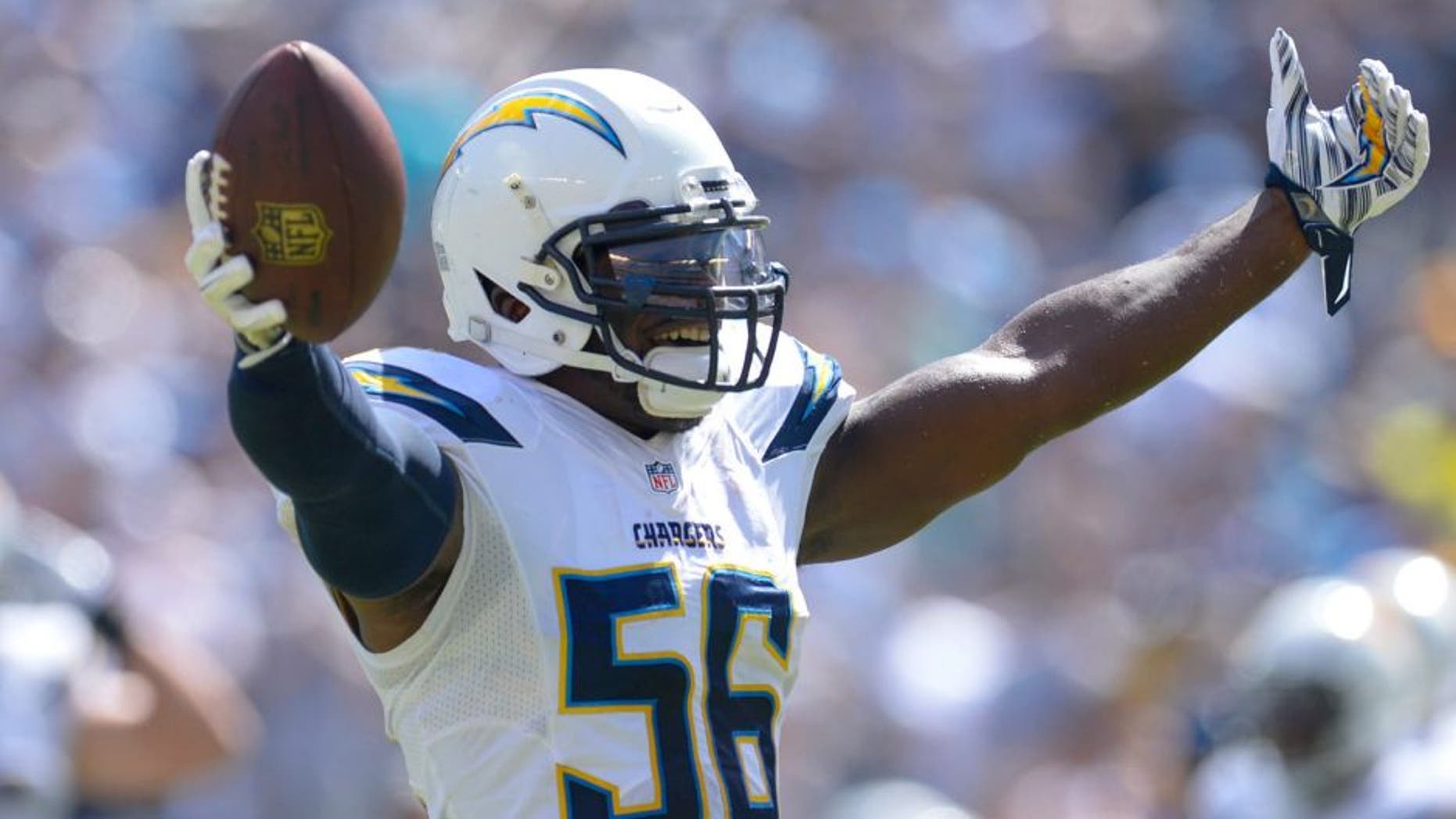 Sep 28, 2014; San Diego, CA, USA; San Diego Chargers inside linebacker Donald Butler (56) celebrates after recovering a fumble in the first half against the Jacksonville Jaguars at Qualcomm Stadium. Mandatory Credit: Robert Hanashiro-USA TODAY Sports