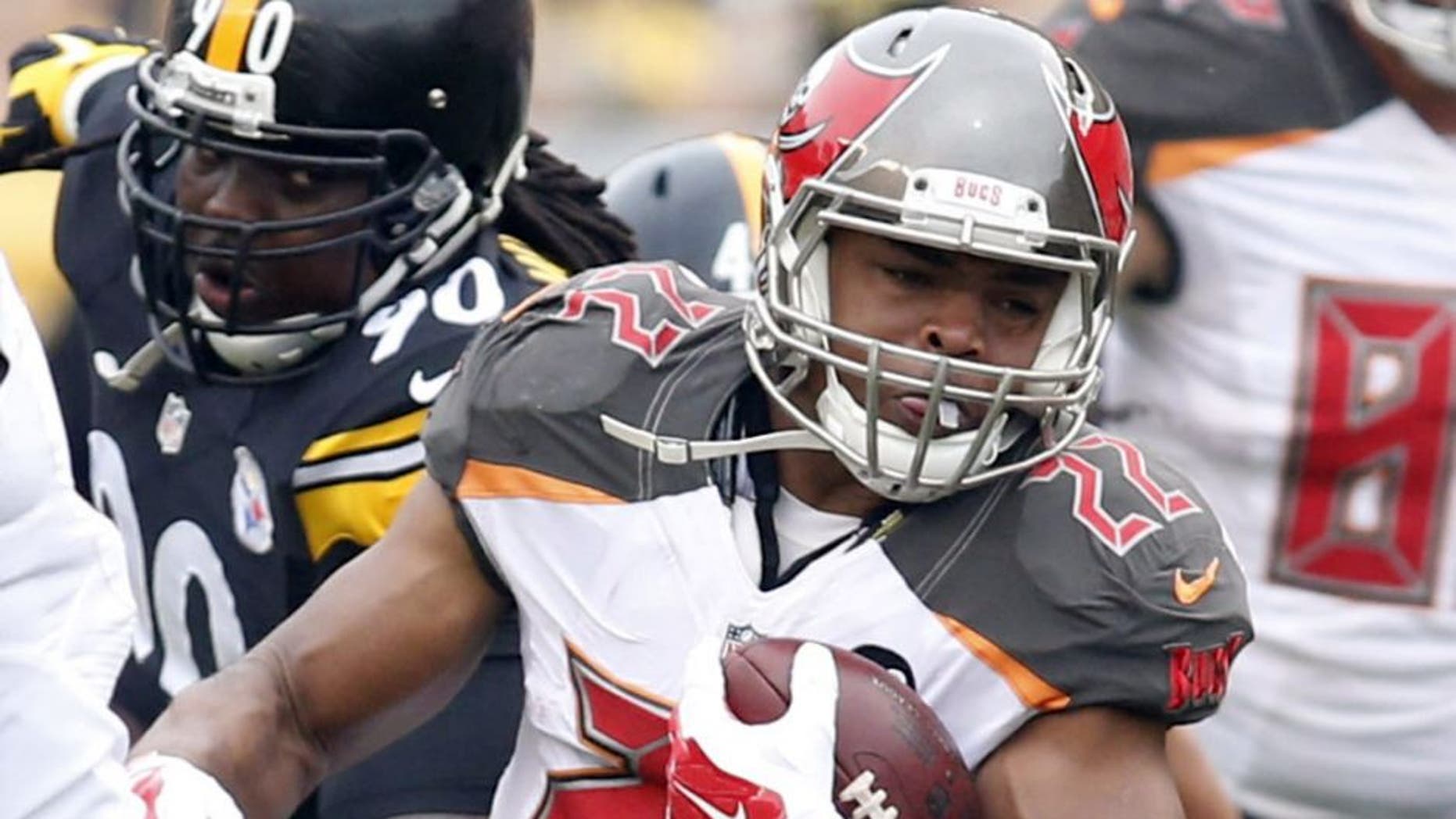 Sep 28, 2014; Pittsburgh, PA, USA; Tampa Bay Buccaneers running back Doug Martin (22) rushes the ball against the Pittsburgh Steelers during the first quarter at Heinz Field. Mandatory Credit: Charles LeClaire-USA TODAY Sports
