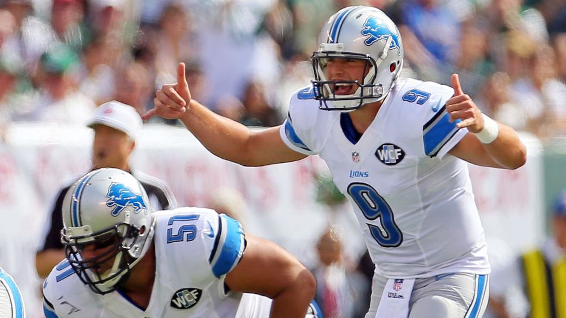 Sep 28, 2014; East Rutherford, NJ, USA; Detroit Lions quarterback Matthew Stafford (9) gestures against the New York Jets during the first quarter at MetLife Stadium. Mandatory Credit: Adam Hunger-USA TODAY Sports