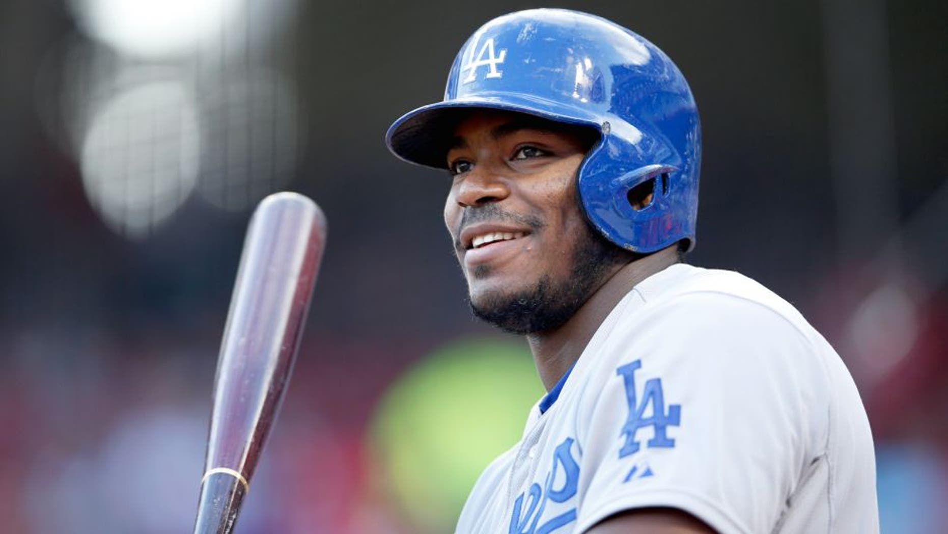 CINCINNATI, OH - AUGUST 26: Yasiel Puig #66 of the Los Angeles Dodgers looks on while waiting to bat against the Cincinnati Reds during the game at Great American Ball Park on August 26, 2015 in Cincinnati, Ohio. The Dodgers defeated the Reds 7-4. (Photo by Joe Robbins/Getty Images)