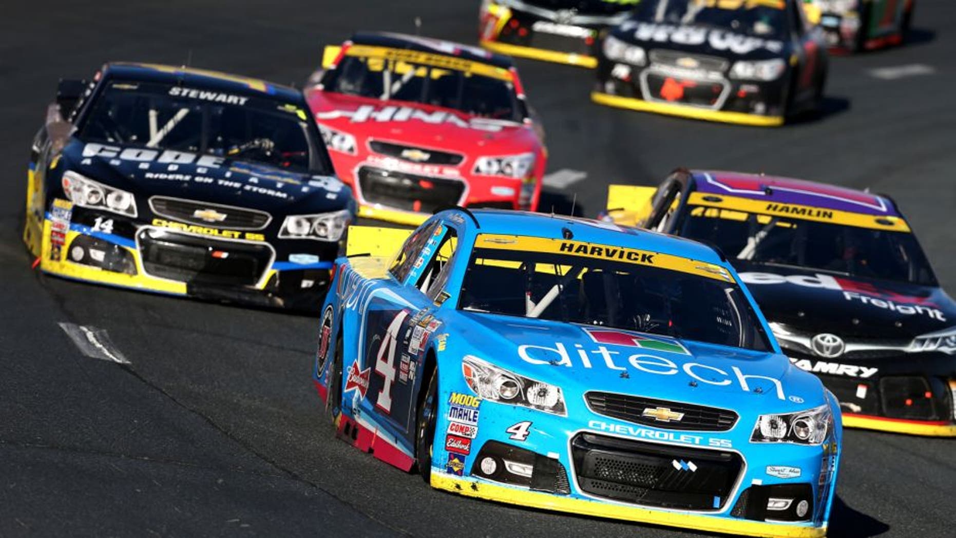 LOUDON, NH - SEPTEMBER 27: Kevin Harvick, driver of the #4 Ditech Chevrolet, leads a pack of cars during the NASCAR Sprint Cup Series SYLVANIA 300 at New Hampshire Motor Speedway on September 27, 2015 in Loudon, New Hampshire. (Photo by Todd Warshaw/NASCAR via Getty Images)