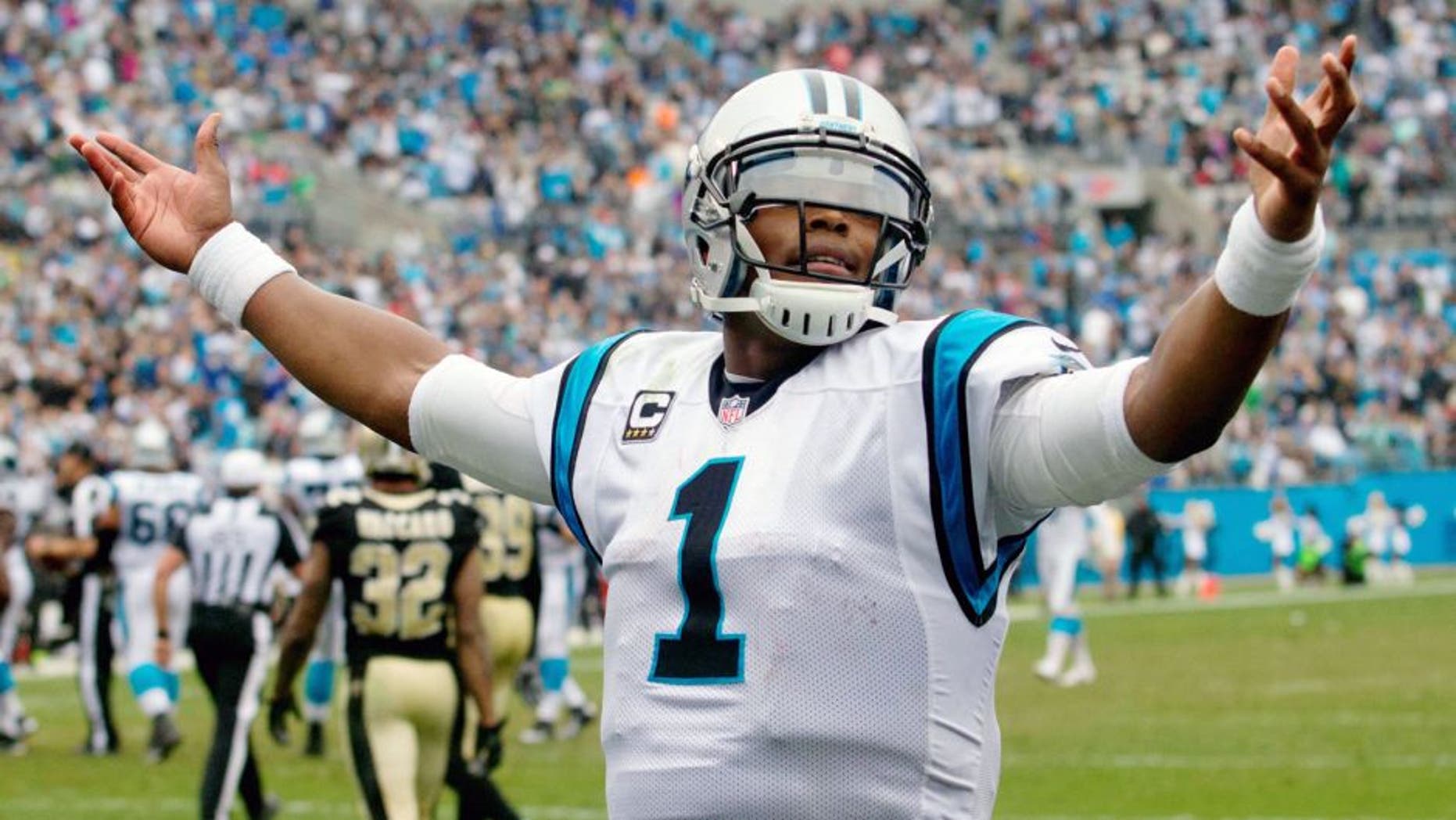 Sep 27, 2015; Charlotte, NC, USA; Carolina Panthers quarterback Cam Newton (1) celebrates after a touchdown during the fourth quarter against the New Orleans Saints at Bank of America Stadium. Carolina defeated the Saints 27-22. Mandatory Credit: Jeremy Brevard-USA TODAY Sports