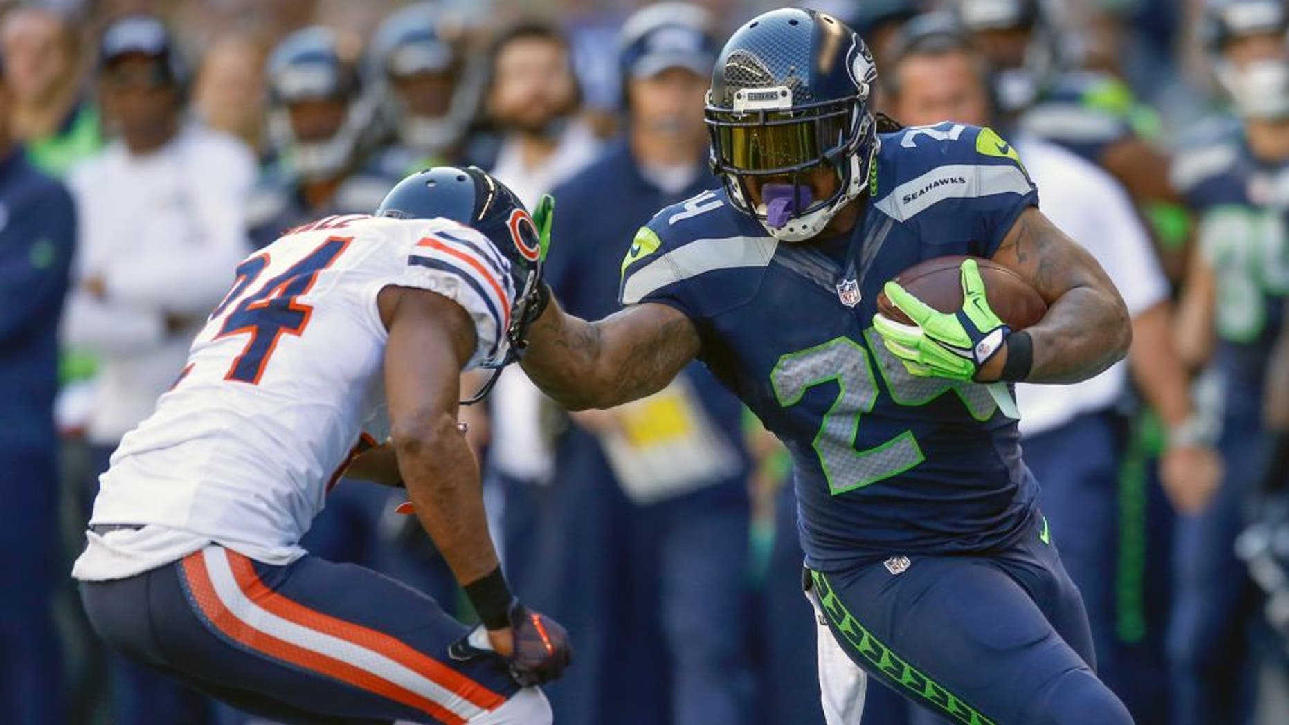 SEATTLE, WA - SEPTEMBER 27: Running back Marshawn Lynch #24 of the Seattle Seahawks rushes against defensive back Alan Ball #24 of the Chicago Bears at CenturyLink Field on September 27, 2015 in Seattle, Washington. (Photo by Otto Greule Jr/Getty Images)