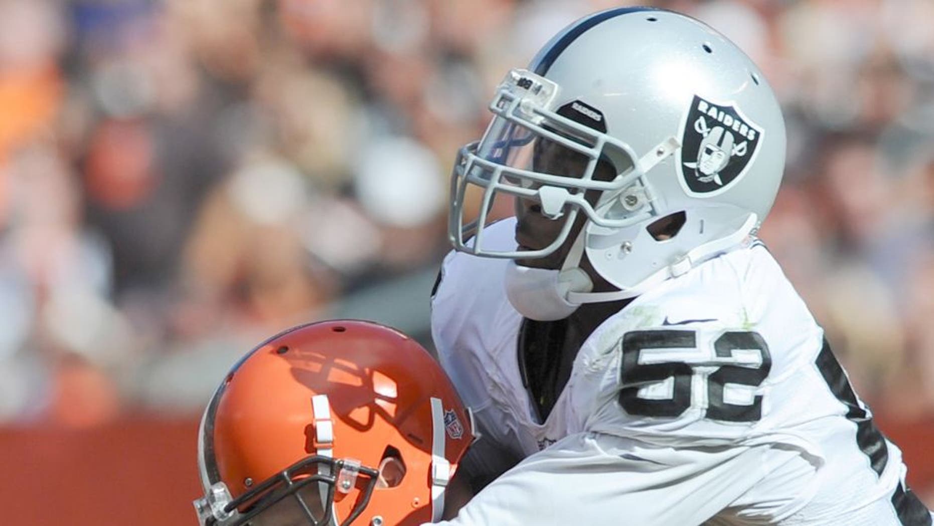 Sep 27, 2015; Cleveland, OH, USA; Oakland Raiders defensive end Khalil Mack (52) sacks Cleveland Browns quarterback Josh McCown (13) during the second half at FirstEnergy Stadium. The Raiders won 27-20. Mandatory Credit: Ken Blaze-USA TODAY Sports