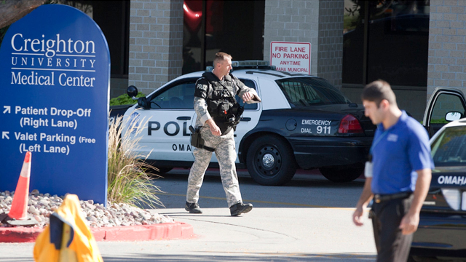 Sept. 29: A police SWAT team member walks out of the Creighton University medical center in Omaha, Neb.